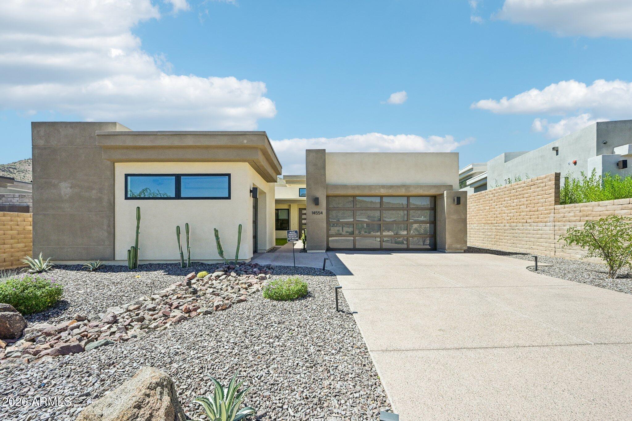 Wake up every day surrounded by the quiet beauty of Adero Canyon. This home sits on one of the community's premier lots, giving you the kind of mountain views that make mornings feel slower and evenings feel softer. The single-level layout feels open and effortless with vaulted ceilings and sunlight pouring through the windows. Every detail has been cared for, and the home feels fresh, modern, and ready to enjoy.

The kitchen is the natural gathering place with its generous island, abundant storage, stainless appliances, and walk-in pantry. It opens to a relaxed living and dining space anchored by a sleek fireplace that sets the tone for cozy nights in or easy entertaining.

Slide open the 4-panel door and step into a backyard designed for pure enjoyment. The custom pool and spa sparkl against the desert backdrop, and the Pentair automation system lets you control heating and cooling right from your phone. It's the kind of space that invites long afternoons, sunset swims, and quiet mornings with coffee.

The primary suite feels like its own retreat, set apart from the two additional ensuite bedrooms. Guests can enjoy their own private casita with a separate entrance, perfect for weekend visitors or flexible use.

This Thaxton plan with casita is ideal for anyone who wants a lock-and-leave lifestyle without sacrificing luxury or views. Adero Canyon offers the peace of a gated community with direct access to nearby trailheads and quick proximity to Fountain Hills dining, golf, and The Adero Resort and Spa. Membership options open the door to fitness classes, a modern gym, tennis, pickleball, and both resort-style and lap pools.

This is the kind of home that blends ease, beauty, and connection to the outdoors in a way that feels effortless.