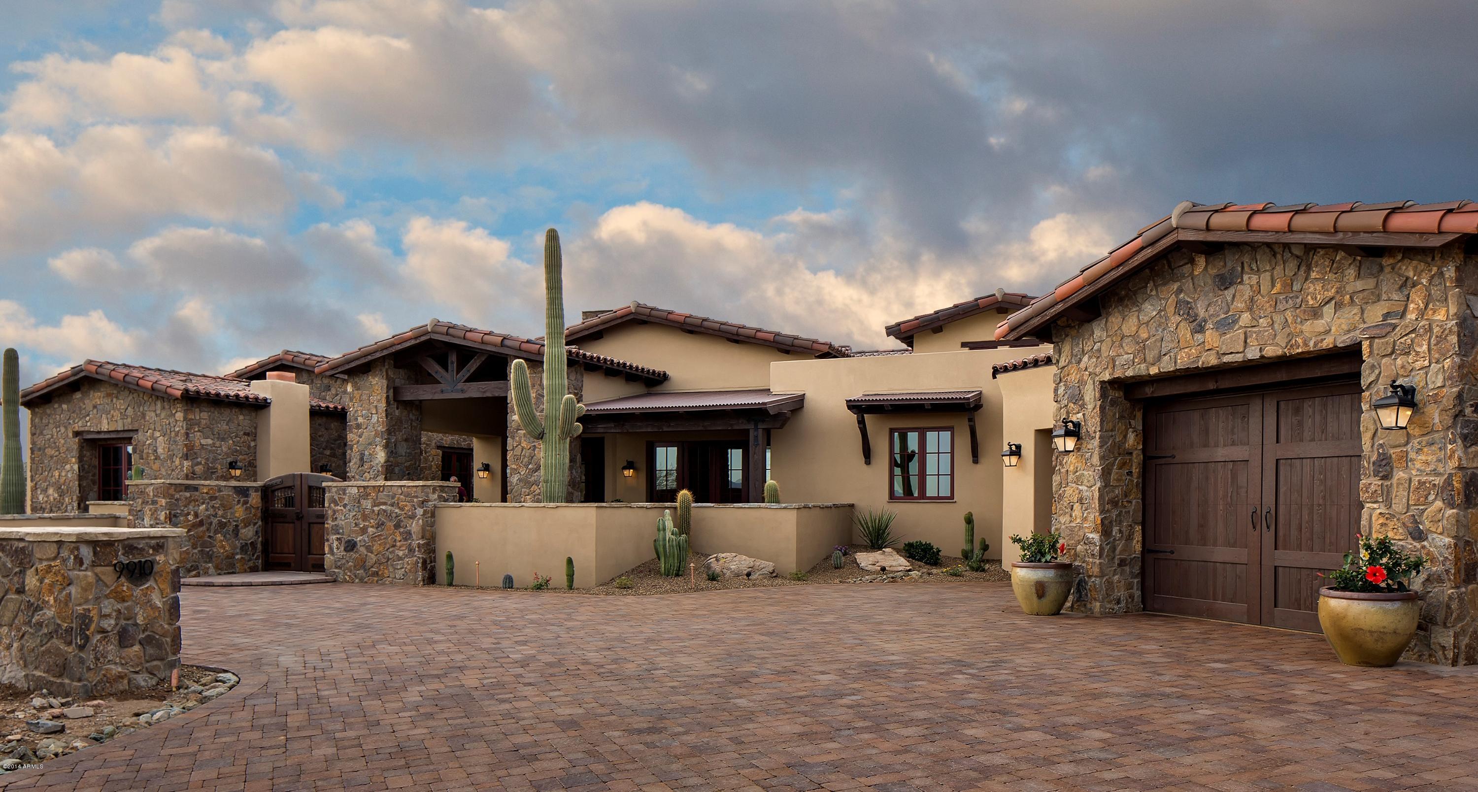 Fabulous NEW Italian Ranch built with abundant and exceptional features and detailing on the 9th hole of Desert Mountain's Chiricahua golf course. NO STEPS!! Spectacular GOLF COURSE, SUNSET, MOUNTAIN, AND CITY LIGHT VIEWS. GREAT ROOM PLAN, 4 beds and 4.5 baths.  Features include extensive use of Venetian plaster, intricate and unusual flooring and door details, brick ceilings, an exercise/bonus room off the Master Bedroom, a Wine Room, a gated front courtyard with fireplace and fountain, disappearing sliding doors in the Great Room, an indoor kitchen fit for a chef, an exquisite ''Locker Room'' for golf gear and art, and a huge back patio with outdoor kitchen, fireplace and firepit.  (See Documents for more details). Equity Golf Membership included, subject to application approval by Club.