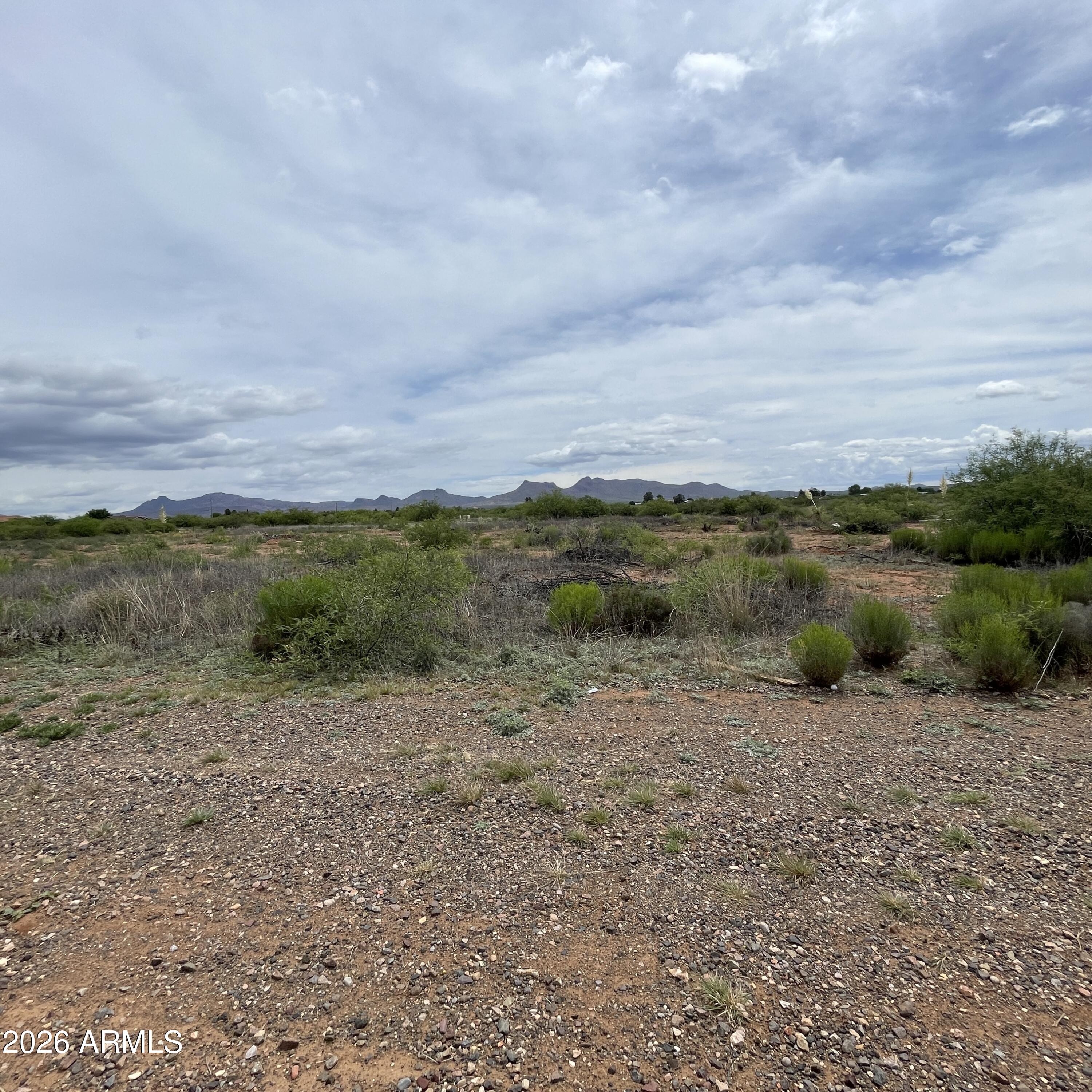 2 lots for sale totaling 3 acres, one 2 acre parcel and one 1 acre parcel.  Gated location close to golf course and fairgrounds, this space provides an ideal scenario for rural living with proximity to town.   All utilities are located at E Golf Course Rd.  No improvements have been made to either lot.   Parcel numbers  41010001S and 41010001M included in sale.  Parcel number 41010001S has a utility easement along the long end of the property, utility easement does not convey, legal ingress and egress will remain for both parcels.  Parcel size on county records for 41010001S lists 3.195 acres, one acre includes utility easement that does not convey.