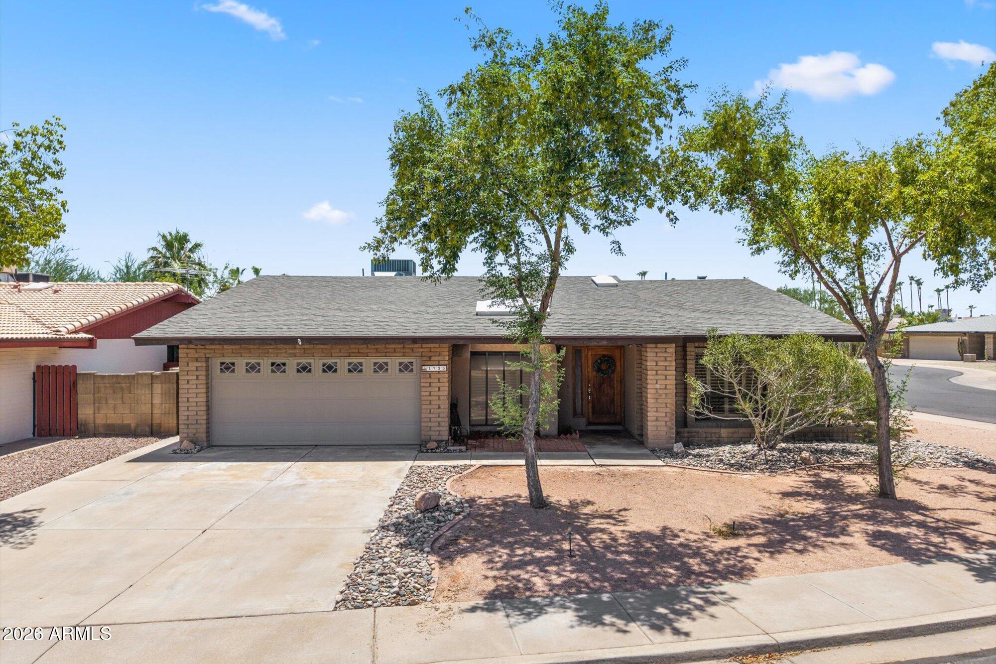 Welcome home to this timeless single-story gem in the heart of Mesa! Beautifully maintained and situated on a quiet corner lot, this home offers the perfect blend of comfort and convenience. Inside, you'll find a bright, open floor plan filled with natural light, plantation shutters, and neutral finishes throughout. The spacious kitchen features ample cabinetry and counter space, overlooking the cozy eat-in dining area with a charming architectural kiva fireplace. The split floor plan offers a private primary suite separated from three secondary bedrooms. Enjoy Arizona living in the spacious backyard with plenty of room to relax, entertain, BBQ, or garden. Conveniently located near shopping, dining, parks, schools, and freeways.