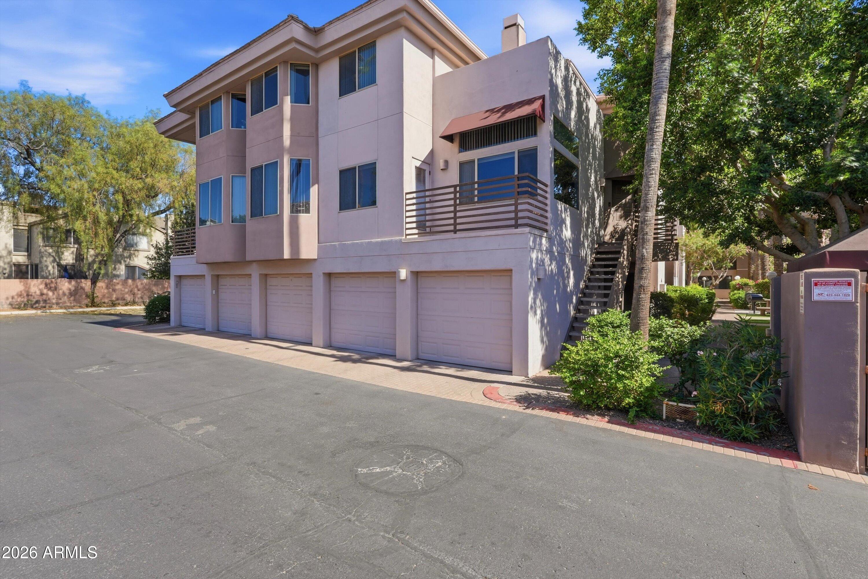 Welcome to Biltmore Palms, a gated condo community offering comfort, convenience, and a prime central Phoenix location. This multi-level home features new stainless steel appliances, new washer and dryer, and a new water heater, important updates for buyers looking for a turn-key move-in. A standout feature is the direct-entry garage from the unit, offering added privacy, security, and convenience. Enjoy low-maintenance living just minutes from Trader Joe's, Whole Foods, Biltmore Fashion Park, and Life Time Fitness, with premier shopping, dining, fitness, and entertainment close by. Ideal as a full-time residence or lock-and-leave home, this condo offers exceptional access to the best of the Biltmore area.
