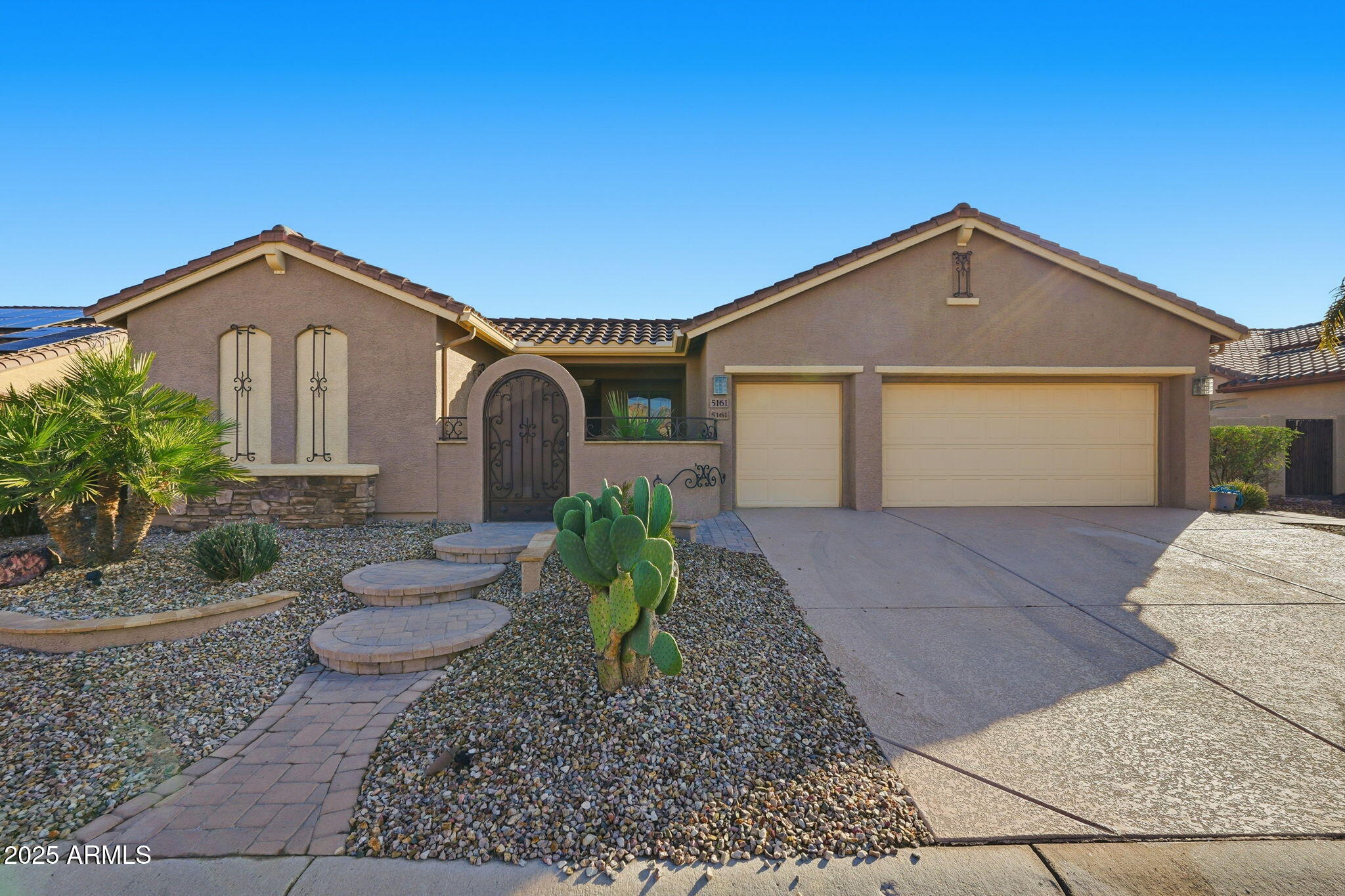 One-of-a-kind Entertainer's Oasis with Private Casita!  This stunning Integra Block home offers an ideal blend of luxury, comfort, and unforgettable outdoor living, complete with a separate Guest Casita featuring its own private bath & entrance.  Step through the iron gate into a shaded, paved courtyard accented by a serene pond and outdoor stone fireplace. Inside, the open great-room floorplan showcases hardwood flooring, gas fireplace, surround sound, mood lighting, lighted niches & plantation shutters.  The granite and stainless kitchen is perfect for entertaining.  The primary suite has access to the outdoor enclosed patio and hot tub/spa.  The Backyard Oasis is truly spectacular, private, peaceful, and designed for year-round enjoyment. Features include an impressive outdoor kitchen with seating and tabletop fire feature, built-in BBQ, custom waterfall with babbling brook, two ponds with a footbridge, in-ground fire pit, hot tub/spa, artificial turf, garden area with lime & Meyer lemon trees, and both a screened-in and covered patio with misters. Multiple seating zones offer tranquility and entertainment options for every occasion.  Additional highlights include: extended garage with 220V outlet (EV charging capable), golf cart outlet, attic fan, garage cabinets, fan cooling system, 4 ft. extension, shed, roomy side yards (one double-gated for pets), exotic ceiling fans, dimmer switches, gutters, mood lighting, RO system, and more. Newer A/C unit as well.  This remarkable home is truly one of a kind.  Don't miss your chance to own this fabulous entertainer's paradise!  Golf cart is available on a separate bill of sale.
