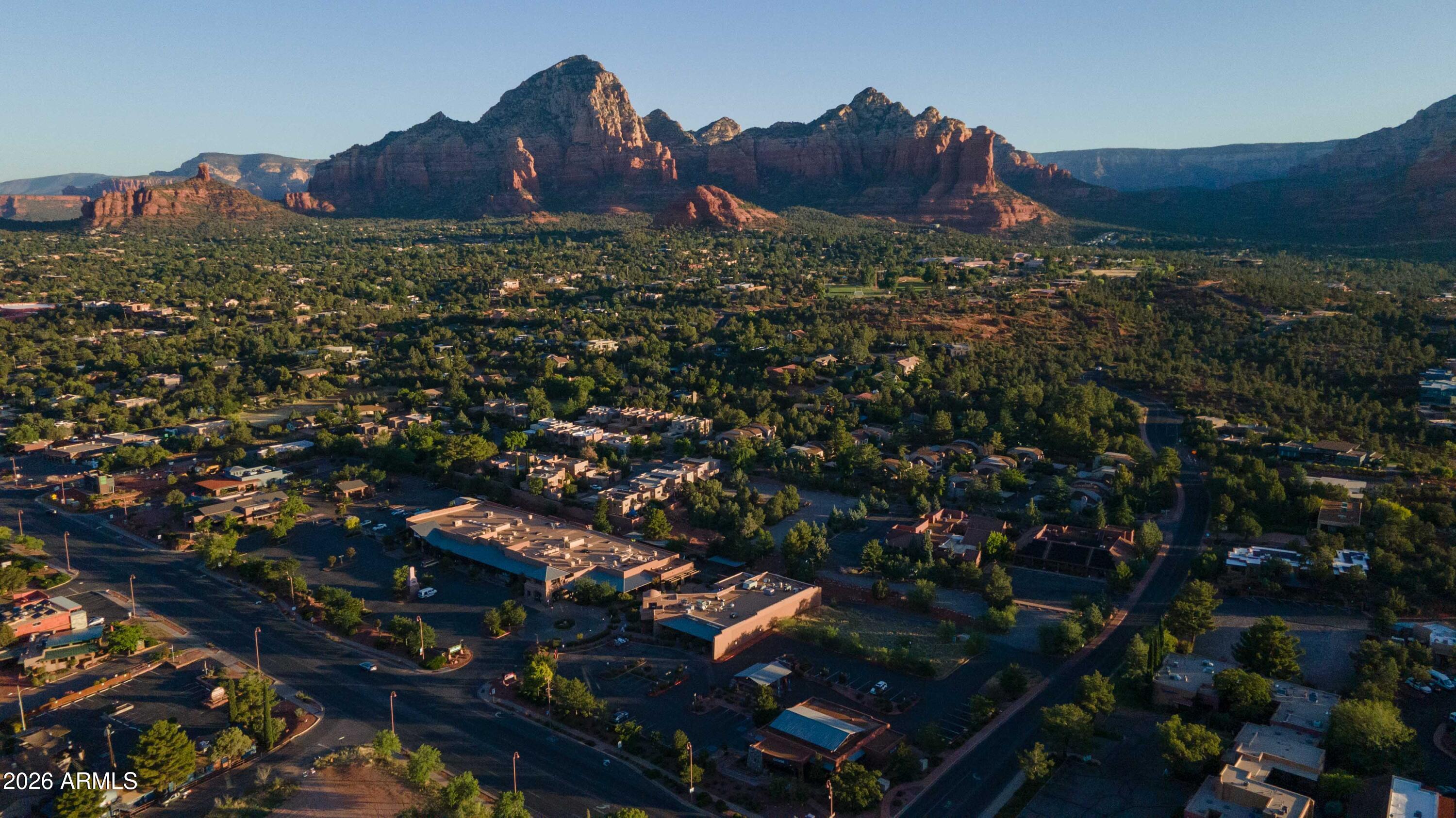 Zoned for lodging and offers a rare West Sedona infill opportunity for a boutique hotel, lodge, or other visitor-oriented hospitality concept. Positioned near SR 89A, restaurants, retail, trails, and community amenities, the site is well-suited for a lodging project that captures Sedona's year-round visitor demand. The property may also support complementary commercial uses such as restaurant, café, retail, wellness, or service-oriented space, creating a mixed-use destination that serves both guests and the surrounding neighborhood. Buyer to verify zoning and CFA.