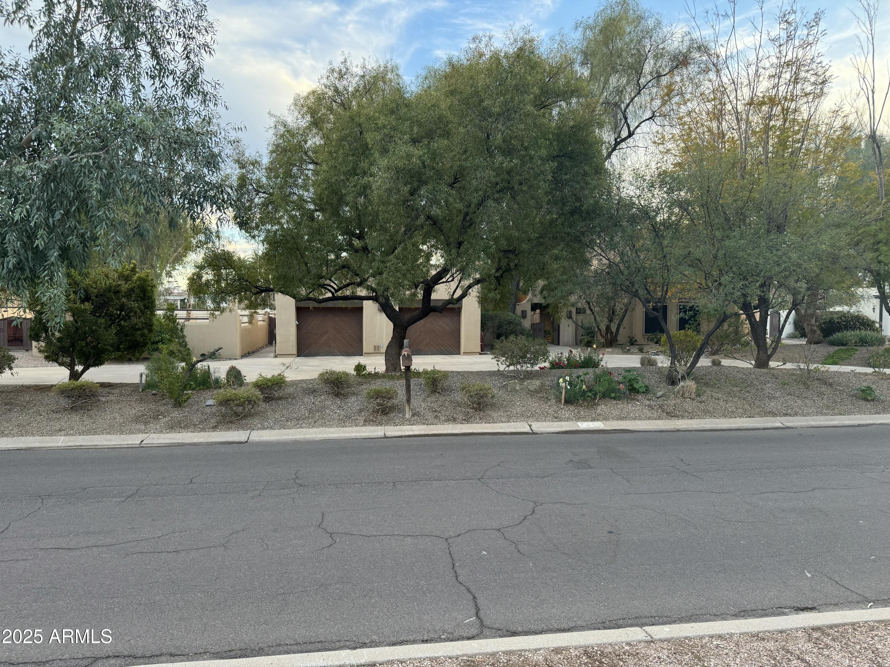 Amazing Investment Opportunity with Land + Location. This expansive 1.011-acre property in Paradise Valley Farms offers incredible potential and is zoned for horses. Nestled on a prestigious street within one of the most sought after communities in the valley, this home neighbors multi-million dollar estates.  The spacious backyard presents endless possibilities, providing ample space to create a resort-style pool, a guesthouse, a tennis court, or any other luxurious amenities you desire. Scrape and build new, or remodel, the possibilities are endless