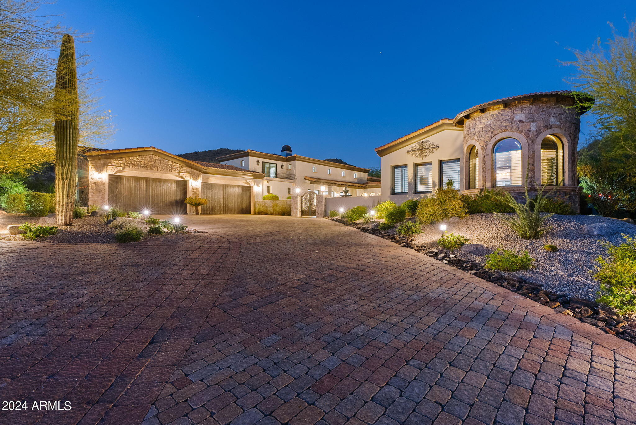 Hillside mountain masterpiece home that is beautifully situated on a cul-de-sac  lot featuring 5 bedrooms and 5 bathrooms. This amazing  layout has two master suites. The Gorgeous remodeled gourmet kitchen features a walk in pantry, built in appliances including a 48 inch gas cook top, dual wall ovens, built in ice maker and so much more. Enjoy the media room, office and huge family room with wall of glass to the back yard. You will love the Soaring 20+ foot ceilings, plus the beautiful stone and brick accents throughout. This open floor plan has new large format porcelain floors, all new base boards plus all new bathrooms. This home has a fabulous layout for entertaining! The backyard features a mosaic tile pool and spa, plus a huge outdoor kitchen with  built in bar and BBQ. Enjoy sunsets and  the putting green plus fabulous mountain views. front courtyard offers amazing sunsets and city light views plus a beautiful fireplace and don't forget the loft offering beautiful views of the valleys. so much to see and enjoy and plus this home is MOVE In READY!