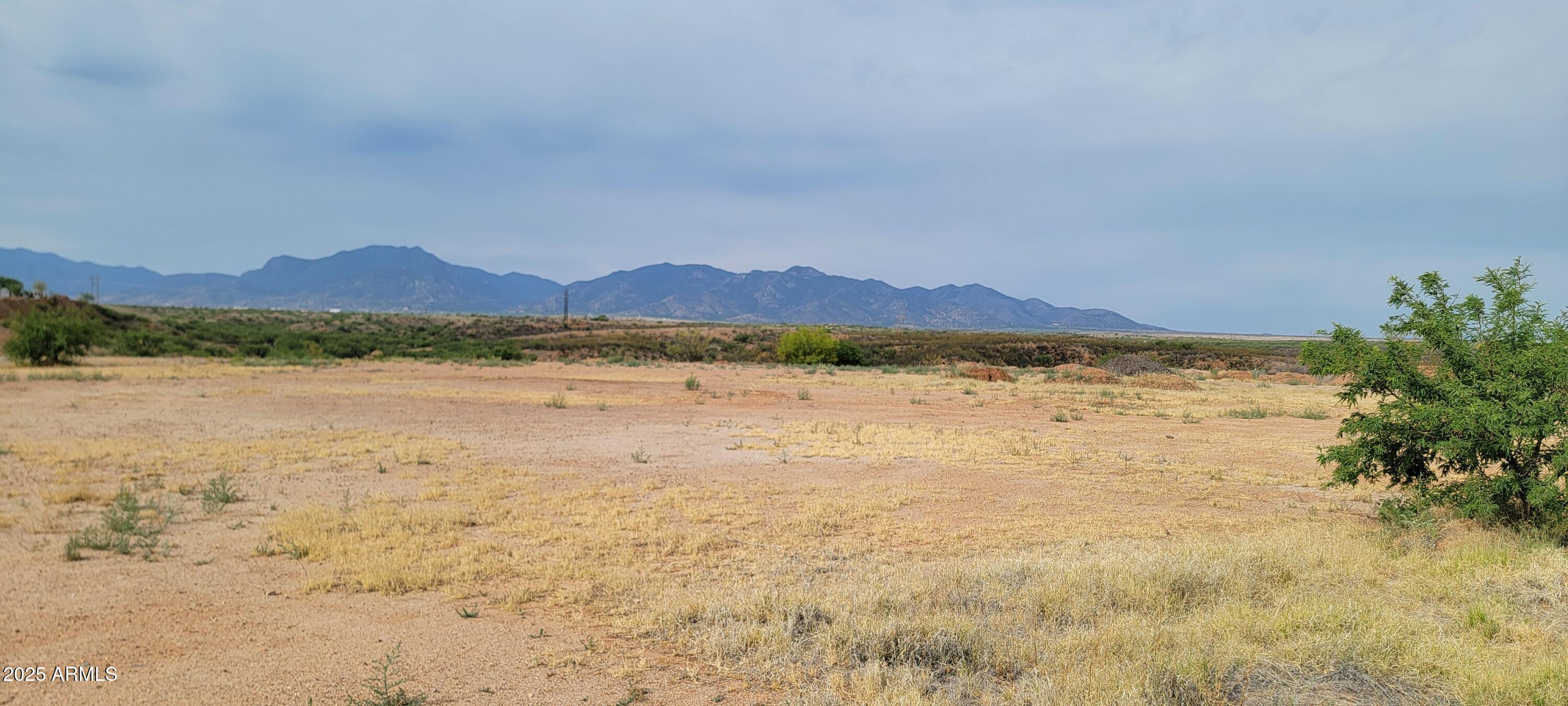 What an opportunity! This parcel has a very large level pad that is ready to go. City services and utilities are available. This parcel can be used for commercial as well as residential purposes. The view is beautiful too. The property has great access for a business as well.