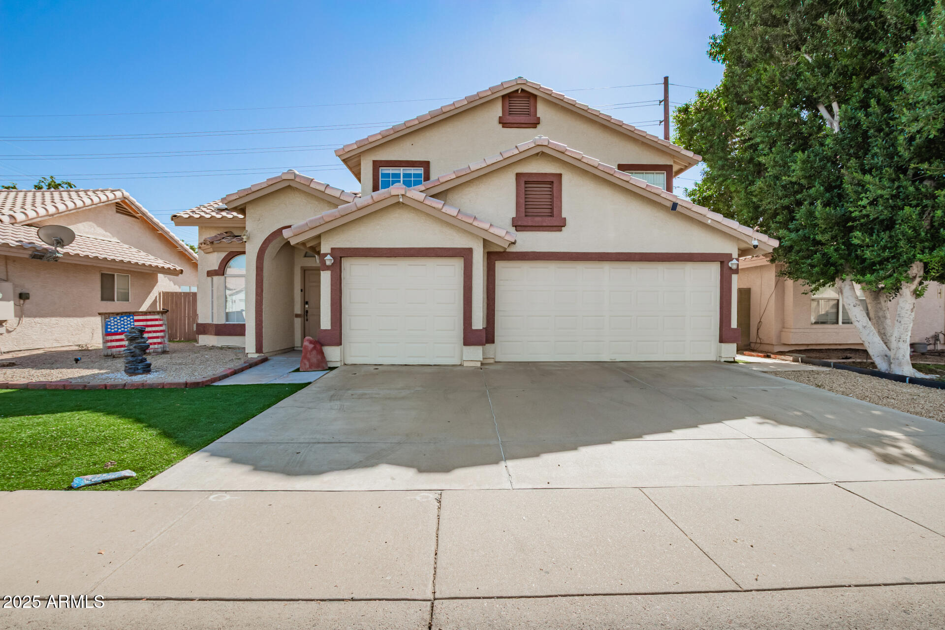 Enjoy resort living in Val Vista Lakes with a lagoon beach pool, Jr. Olympic pool, tennis, pickleball, gym & more! Two-level home with solar panels & 3-car garage! Features clerestory windows, wood-style floors & bright living/dining areas w/high ceilings. Family room offers a cozy fireplace & barn doors to the backyard for seamless indoor/outdoor living. Kitchen boasts granite counters, SS appliances, island, pantry & breakfast nook. Updates: new roof & AC (2021), stove/microwave (2022), dishwasher & water filtration (2023), pool equipment (2024), water softener & water heater (2025).  The shed in the backyard has AC and could be great for many things.