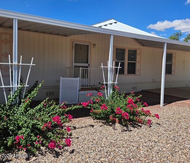 1,680 square foot home on a beautiful, easy care lot. 3 bedroom, 2 bath. 2 car carport, 2 additional slab parking spots. Home is located in a desirable gated community with   two clubhouses, 2 pools (one indoor) and a spa. Home does need some work.