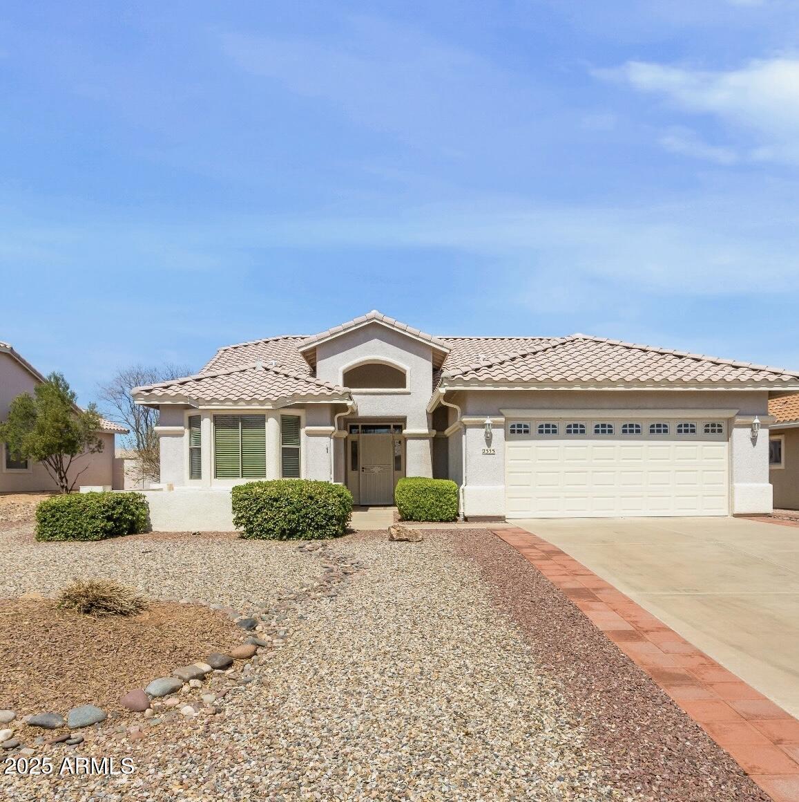 Welcome to this great home located in Winterhaven, a desirable 55+ gated community. This beautiful 3-bedroom, 2-bath home has a perfect layout for easy living. The home backs to the wash green belt providing a private & tranquil setting.  Enjoy stunning sunsets & mountain views from the large fully screened-in Arizona room. The property features beautifully landscaped front and back yards with patios, perfect for outdoor relaxation or gatherings. The two-car garage includes a work area with sink, plenty of storage cabinets, & a door to outside.  This wonderful home is ready for its new owner to enjoy all the amenities this vibrant community has to offer which include 2 clubhouses, 2 swimming pools, gym, fitness classes & is close proximity to the Pueblo del Sol golf course as well. l