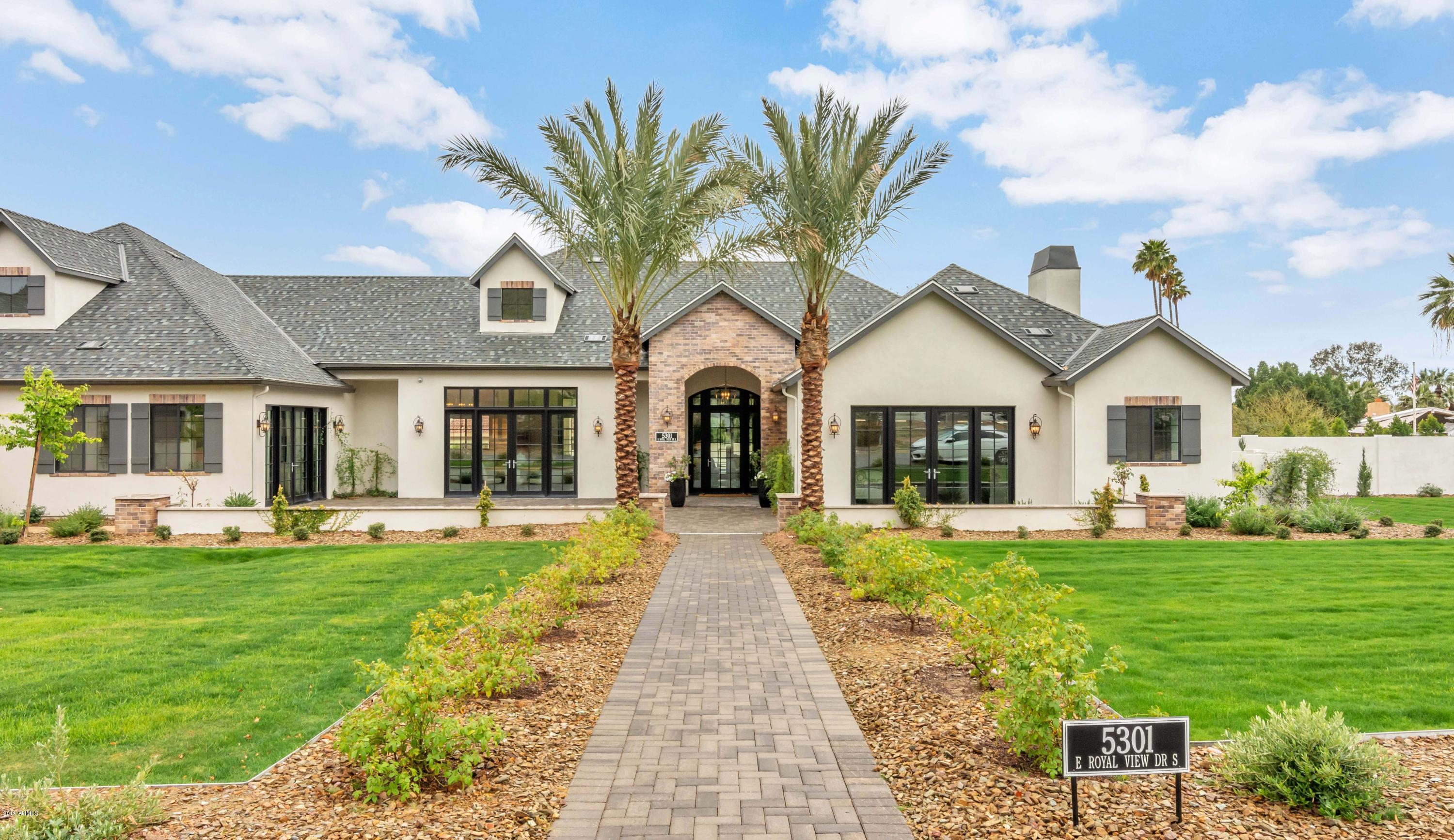 This brand new home is perfect for a large family or the couple who yearns to entertain. With soaring ceilings and grand spaces, it's luxurious and elegant, yet offers tremendous warmth and unparalleled character. The gorgeous courtyard leads to a gracious foyer and into a home filled with magnificent rooms. The island kitchen is divine and flows beautifully into the spectacular great room, the living room is formal, yet serene, the dining room is just exquisite, and all the bedrooms and bathrooms are outstanding, including a fabulous master hideaway with a very chic bath. The home's high quality, ultra-stylish finishes include the hottest design elements on the market. You'll be impressed at every turn from the flooring to the lighting and each carefully thought out detail in between. Extra large doors and picture windows perfectly frame the breathtaking backyard complete with pool, waterfalls, spa, built-in barbecue, fire pit and grand covered patio, all set amongst mind-blowing mountain views!