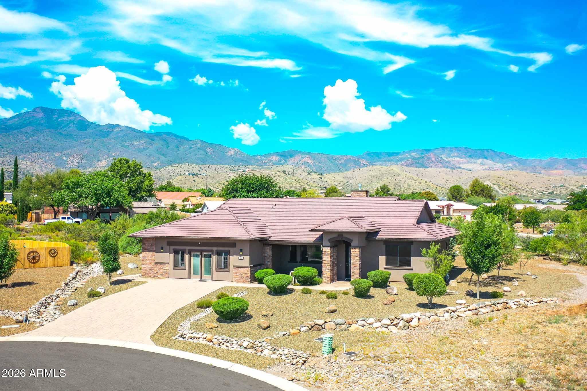 Surrounded by majestic mountain views,  Crossroads at Minghas boasts 2 beautiful parks and a maintained  trail for your enjoyment, HOA $100 per year! Enjoy better health in this Energy star 5 star rated green built home with EPA indoor air plus and solar! Georgous floor plan has high ceiilings, built in entertainment center, see-through fireplace between dining room and great room, tile floors, a huge covered deck across the back and in front of house, the kitchen has marble counter tops, Samsung gas stove  and appliances,Beautiful wood look, ceramic tile floors. Huge covered Patios off the front and back of house for your outdoor enjoyment. The views are amazing! You are close to all the amenities the Valley has to offer, Hospital, Junior college, shopping, gym, local parks & much more!