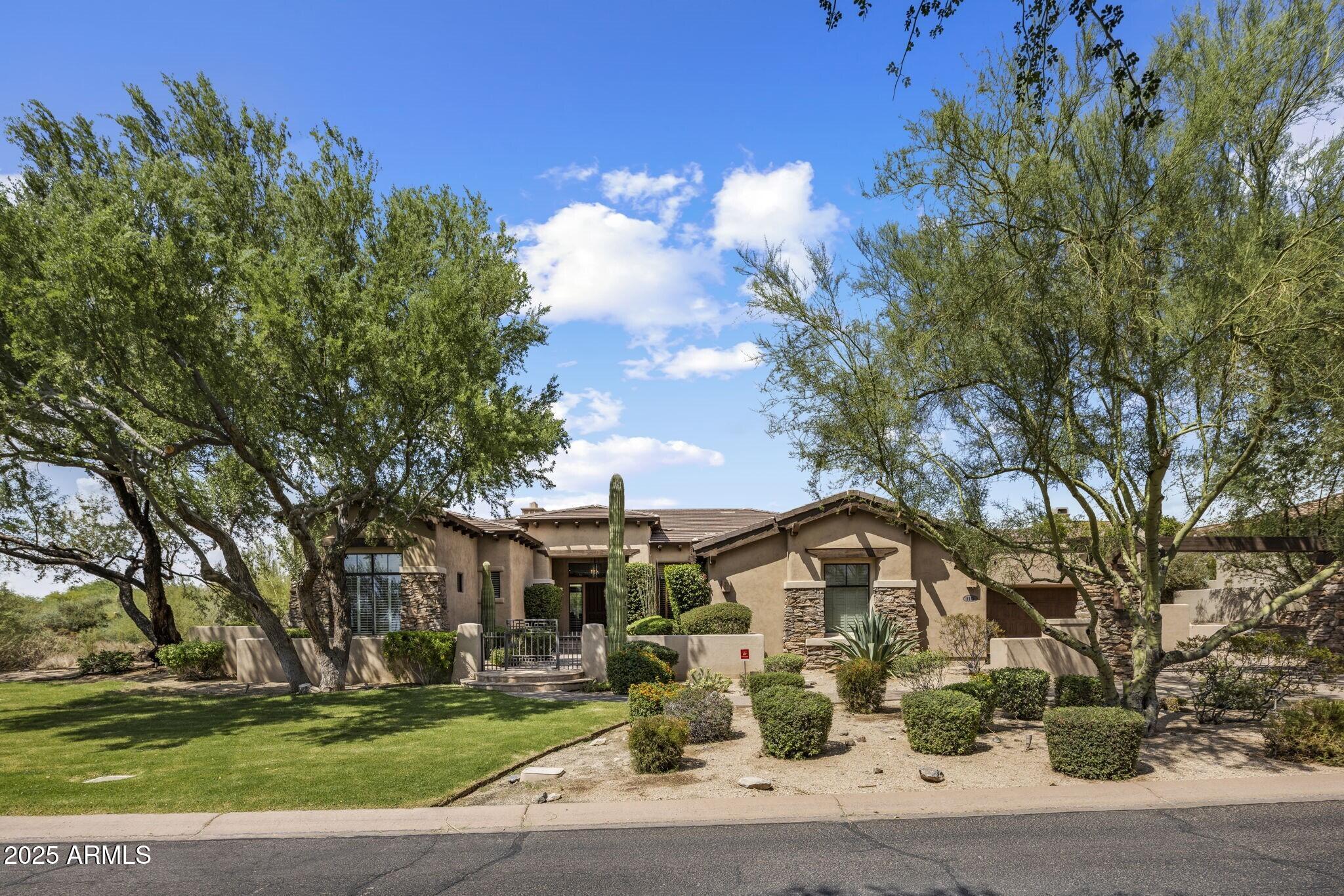Timeless Single-Level Living in DC Ranch

This elegant one-level residence blends luxury and livability with a highly coveted location just moments from DC Ranch Country Club. Designed for comfort and entertaining, the home offers five bedrooms and four-and-a-half baths, including a private guest casita ideal for visiting family and friends.

At the heart of the home is a handsome office retreat, complete with floor-to-ceiling shelving and exceptional privacy — a space equally suited for focused work or a refined library setting.

The open, light-filled interiors connect seamlessly to the outdoors, where a sparkling pool and spacious patio create the perfect setting for Arizona living..... ...A three-car garage provides both practicality and storage, while the home's thoughtful single-level design ensures ease of everyday living.

Positioned on a premium lot that sides to a lush green park, the property enjoys added privacy and natural beauty, with walking paths, club amenities, and the charm of DC Ranch just steps away.

This is a rare opportunity to enjoy luxury, convenience, and community all in one timeless Scottsdale retreat.