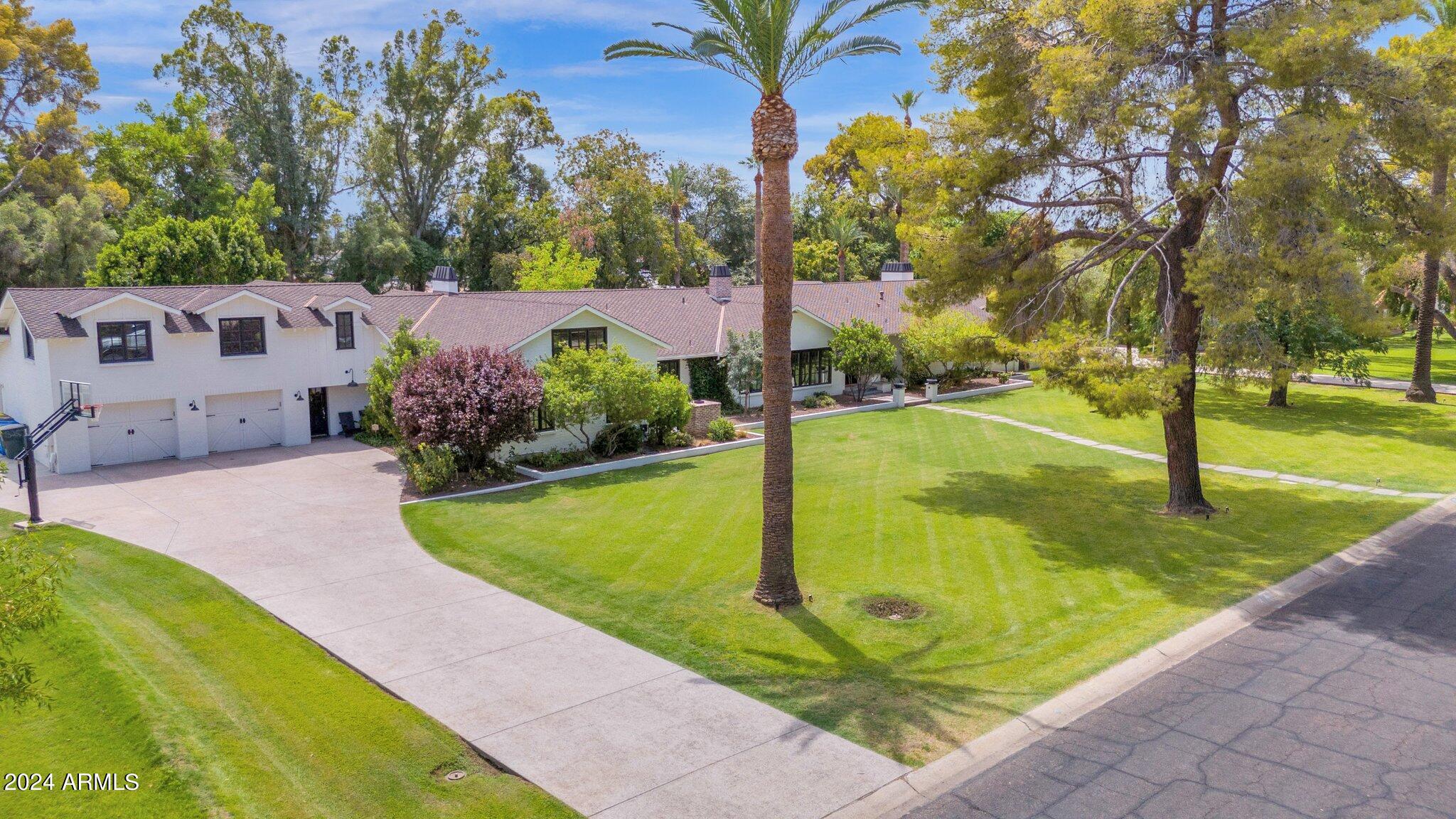 Not many opportunities like this come available. Here's your chance to own this beautiful estate home in N. Central Phoenix. This home sits on a jaw dropping 1.4 acre irrigated lot. Situated on prestigious Berridge Lane. Surrounded by multi-million dollar estates. N/S exposure. 6349 sf of living space while maintaining minimal lot coverage. Massive front/rear yards. Original home was built in 1946 and expanded in 3 separate phases. Home maintains all the classic characteristics, yet modernized. 5 beds/4.5 baths+half at caba. Full in-law suite/guest quarters with private entrance, kitchen, living, and bed/bath. Multiple living areas t/o home. Sitting area off kitchen w/wainscoting & classic wood trimmed pillars. Living room w/fireplace & oversized beamed ceilings looking out to backyard Family room w/10ft+ flat ceilings, original bee-hive fireplace, and french doors to front sitting area with gas fireplace(3 interior fireplaces/2 exterior). Updated kitchen w/farmhouse sink, custom tile backsplash, gas range, B/I fridge/ice maker(24), and drawer micro. Wood floors t/o. Tile at baths. Primary bedroom has an attached office w/fireplace, walk-in closet, and classic bay window. Primary bathroom was renovated in 2018. Oversized walk-in shower, dual vanity, and water closet. All secondary bedrooms are very large in size. 2 of the secondary rooms share an adjoining bath. Farmhouse floating sink, partitioned shower, toilet, and urinal. Expansive rear patio w/separate exits off living and family rooms. Soaring vault w/exposed tung/groove. Beautiful diving pool and cabana was just renovated. New pebble sheen, pool equipment, and tile. Custom decking/outdoor barbecue. Cabana features a renovated half bath, full bar setup, and custom cabinetry. Sour orange trees recently added for privacy. Multiple trees surround the perimeter of the yard. The 2 car garage is tandem setup. Could accommodate up to 4 cars. RV hookup off front drive. New custom all steel front door. New exterior paint and custom metal chimney caps. Classic crank style dual pane windows. Sprinklers/drip front/back(portion). Plenty of room for potential garage, sport court, or additional detached guest quarters. Convenient to downtown, freeways, and all of Uptown's popular eateries. Don't miss this opportunity.
