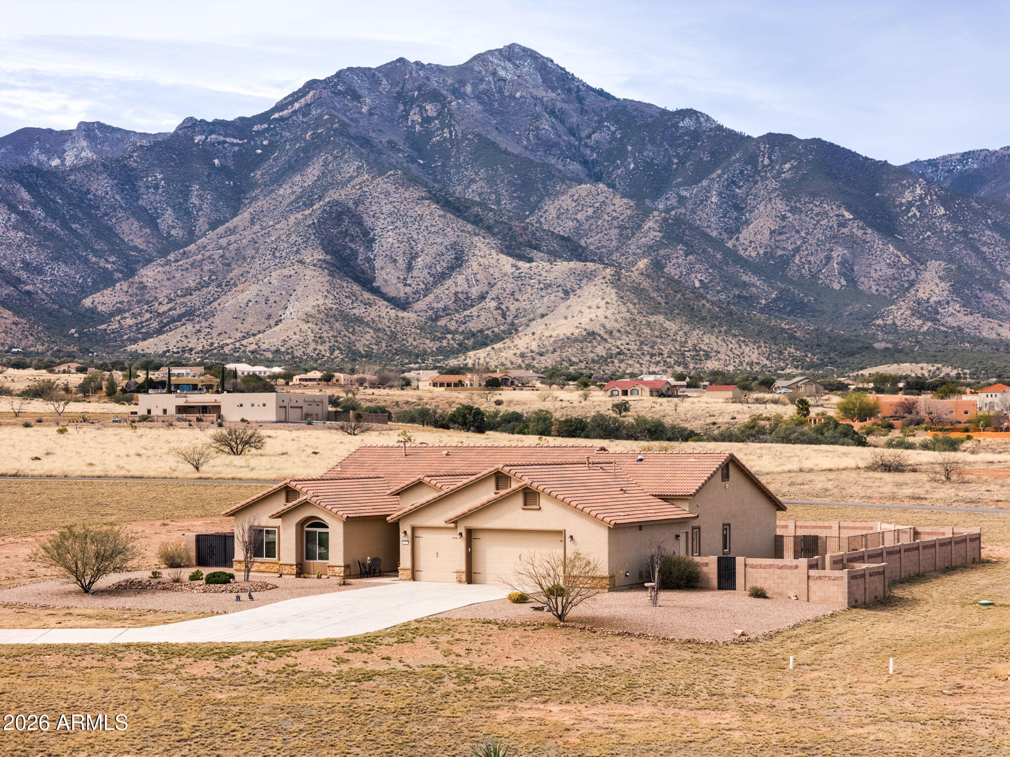 Set behind the gates of the prestigious Wild Horse community, this refined 4-bedroom, 2.5-bath residence offers approximately 3,040 sq ft of elegant living space framed by majestic mountain views!

From the moment you enter, custom lighted architectural niches and a dramatic fireplace create a warm yet sophisticated atmosphere. The gourmet kitchen is designed to impress, featuring generous prep space and seamless flow into expansive living and dining areas - ideal for intimate gatherings and large-scale entertaining.

Thoughtfully appointed with built-in surround sound, patio heaters, and a palatial primary suite - the home delivers an elevated living experience throughout. The oversized 3-car garage provides abundant space for vehicles, storage, and recreational needs.