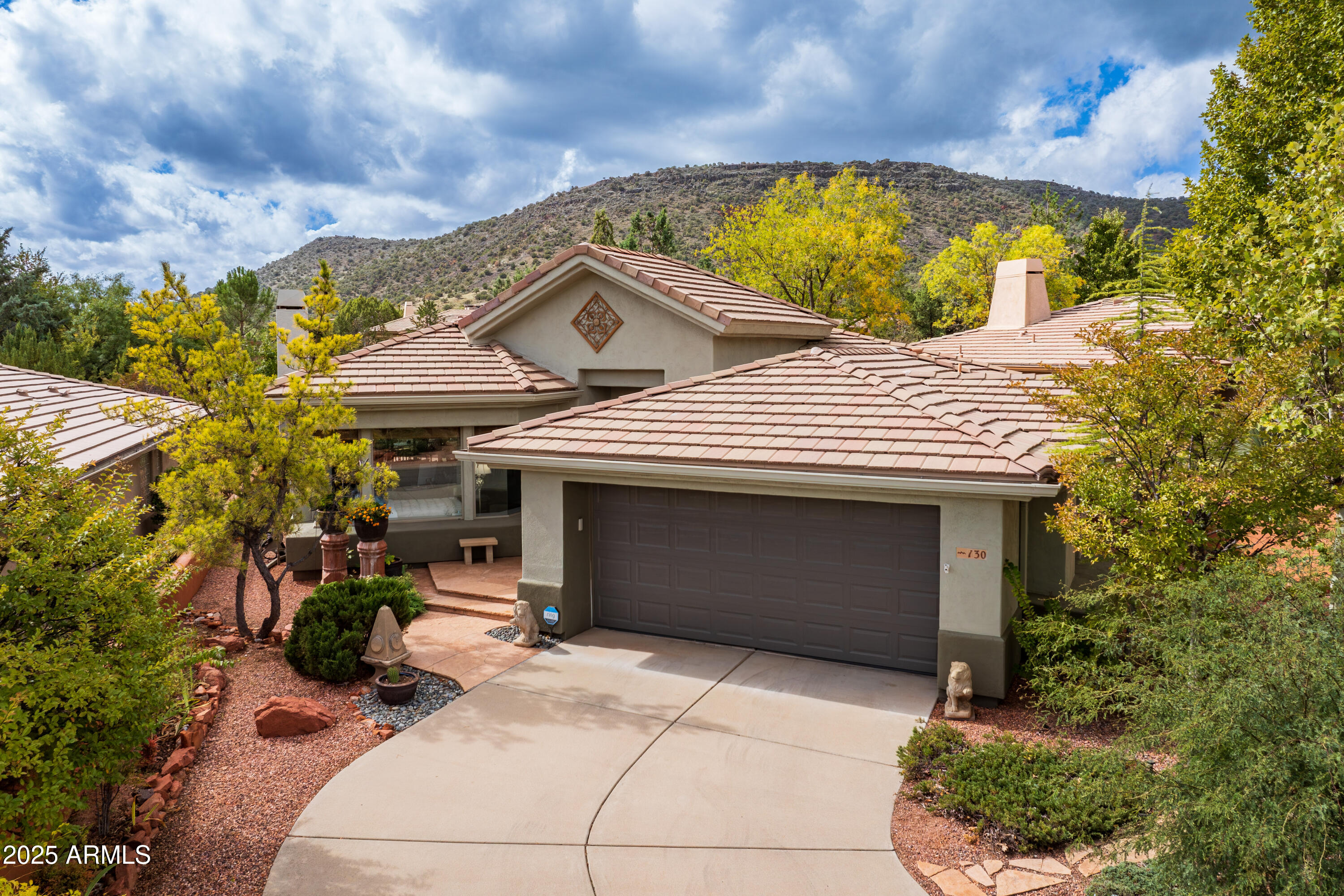 Newly relisted and positioned as one of the best value opportunities in Sedona Golf Resort. Located on a quiet cul-de-sac street, this well-maintained home offers comfortable living, thoughtful design, and exceptional potential in one of Sedona's most desirable communities. The inviting great room features a striking stone fireplace and opens to a covered patio--perfect for enjoying peaceful mornings or relaxing evenings surrounded by easy-care desert landscaping.

The open kitchen includes stainless steel appliances, durable countertops, and a custom backsplash, creating a welcoming space for everyday living and entertaining. The spacious primary suite offers a large bath and walk-in closet, while the split floorplan provides privacy for guests or an ideal third bedroom or home office. Surrounded by Sedona's stunning red rock scenery and close to golf, hiking, and outdoor recreation, this property presents a wonderful opportunity for a full-time residence, second home, or investment. Priced to allow buyers the flexibility to personalize or update to their taste. Property to be sold as-is.