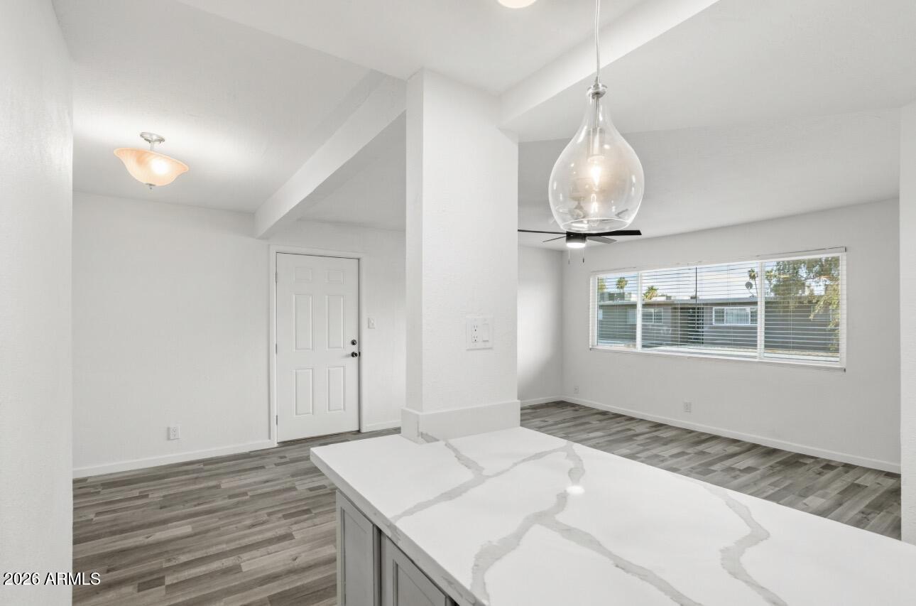Newly updated condo in a highly desirable location! This move in ready home features new wood plank vinyl flooring throughout, gorgeous quartz countertops, and a fully updated kitchen with all new stainless steel appliances. Fresh interior paint, new windows, and updated window coverings give the home a bright and modern feel from the moment you walk in.

The condo also includes a convenient stackable washer and dryer, making everyday living easy and efficient. Step outside and enjoy the beautifully maintained community amenities including a sparkling pool, lush green spaces, tennis courts, and a private dog park/run area perfect for pet owners.

Ideally situated near the Loop 202 freeway, Tempe Marketplace, Mill Avenue District, and Arizona State University. Don't miss this!