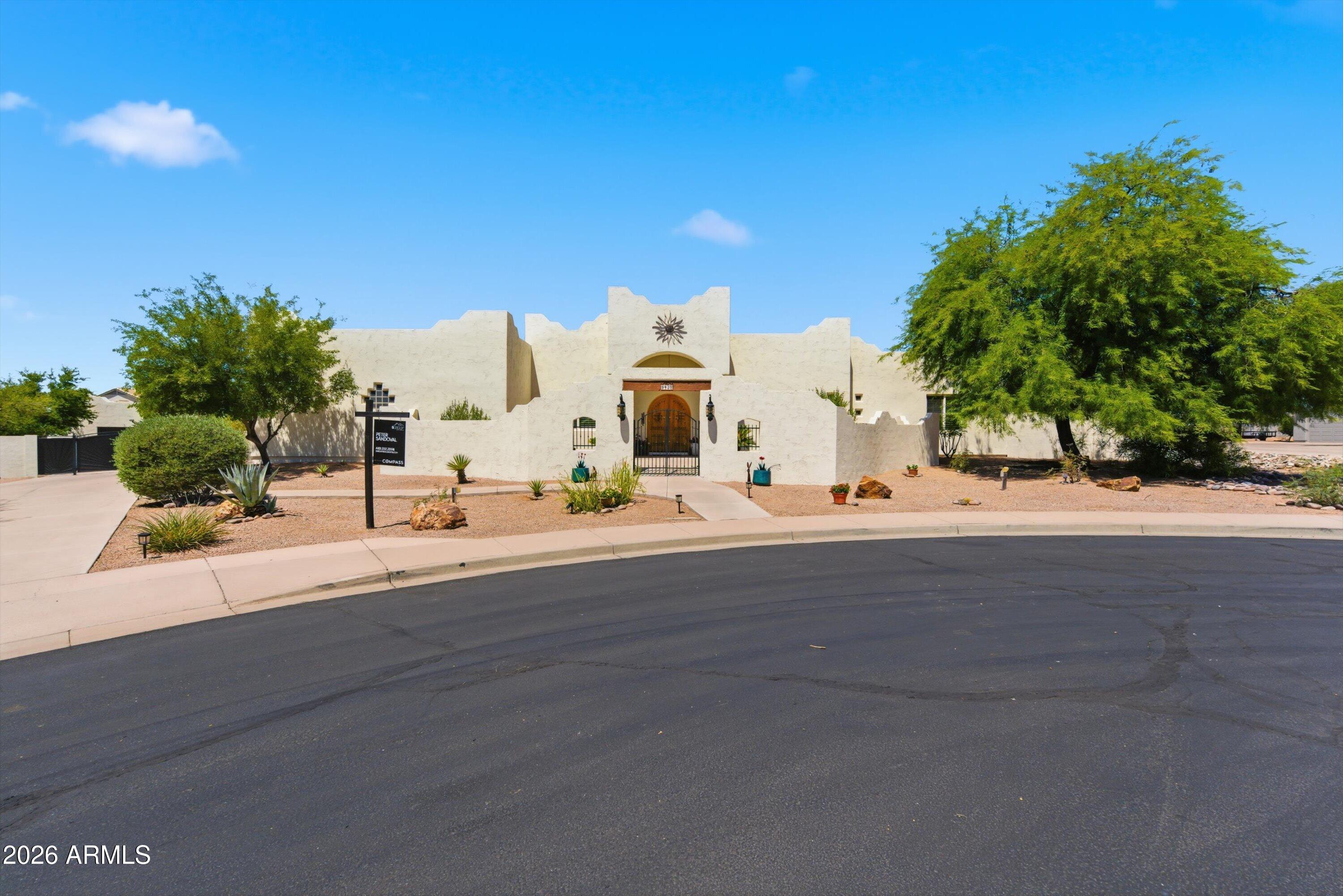 RECENTLY REFRESHED WITH NEW CREAM EXTERIOR PAINT! This stunning NO HOA home now showcase a bright, modernized aesthetic that beautifully complements the surrounding desert landscape. 

The exterior lighting has also been elevated with all new matching solar lights, while the outdoor wrought iron lighting fixtures have been freshly painted.

Inside, you'll find  a gourmet chefs kitchen with dual islands, and spacious guest accommodations and a RARE fully finished basement-ideal for entertaining, multi generational living or a private retreat.  The split floor plan offers both functionality and privacy while oversized windows frame mountain views with natural light pouring in.

Step outside to your resort style backyard featuring a detached workshop, rv space, pool with slide and MORE!
