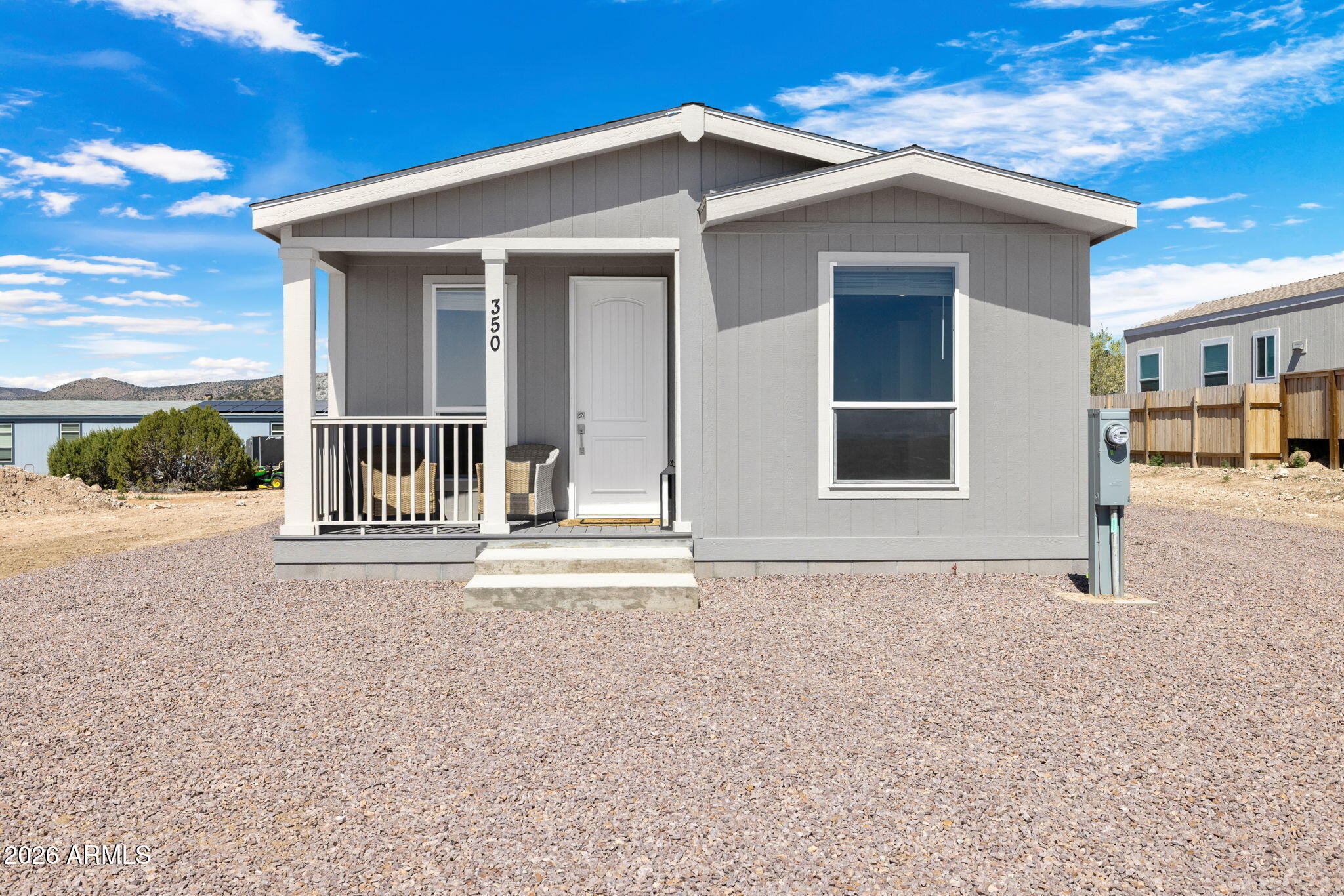 New home, who dis? 350 E Peterson Road in Paulden, AZ is serving brand-new vibes, big mountain views, and zero fixer-upper drama. This move-in ready 3-bedroom, 2-bath manufactured home features an open floor plan, soaring 9-foot ceilings, abundant natural light, and a kitchen built to steal attention with a large center island, ample cabinetry, and room for everything from pancake mornings to chaotic holiday hosting. The private primary suite offers a walk-in closet and a relaxing place to land at the end of the day. With Granite Mountain and Mingus Mountain showing off in the backdrop, plus Prescott National Forest nearby, this new Paulden home is fresh, scenic, and not even a little boring.