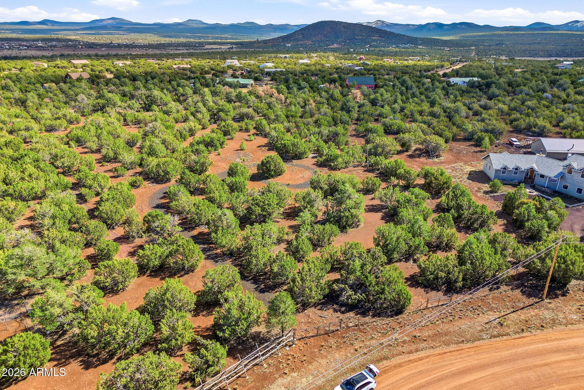 READY TO BUILD YOUR DREAM HOME IN THE WHITE MOUNTAINS OF ARIZONA? This level and heavily treed 2.09 acre lot is located in the subdivision of Winchester Trails Ranches located just East of Show Low in the quaint community of Vernon, AZ. This property is fully fenced with gated access, power available, and a SEPTIC SYSTEM ALREADY INSTALLED. Sellers laid crushed cinders along the left side of the property to guide you to your future home site. The County maintained road to the property adds additional value to your investment. Come enjoy all 4 seasons in the cool White Mountains.