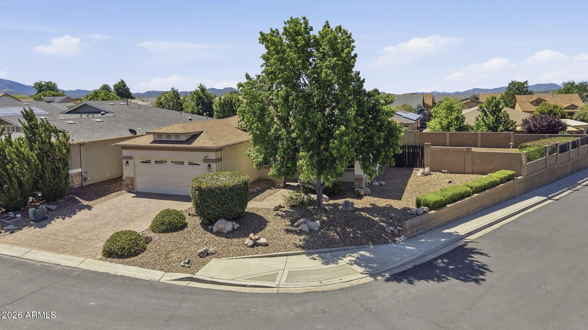 Welcome to this beautifully maintained 3 bed, 2 bath contemporary ranch with den in desirable Quailwood Meadows. Set on an elevated corner view lot, this 1,888 sq ft home offers fresh interior paint, new carpet, granite countertops, and a fresh roof. The thoughtful floor plan includes a formal living room, breakfast nook, spacious great room, and flexible den--ideal for guests, hobbies, or a home office. Outside, enjoy low-maintenance Arizona living with gated fencing, mature landscaping, synthetic turf, a 6x10 shed, and an extended paver back porch designed for relaxing or entertaining. Take in beautiful Bradshaw Mountain views from the backyard and enjoy community amenities, including a pool, tennis, a fitness center, and a clubhouse, all near public golf.