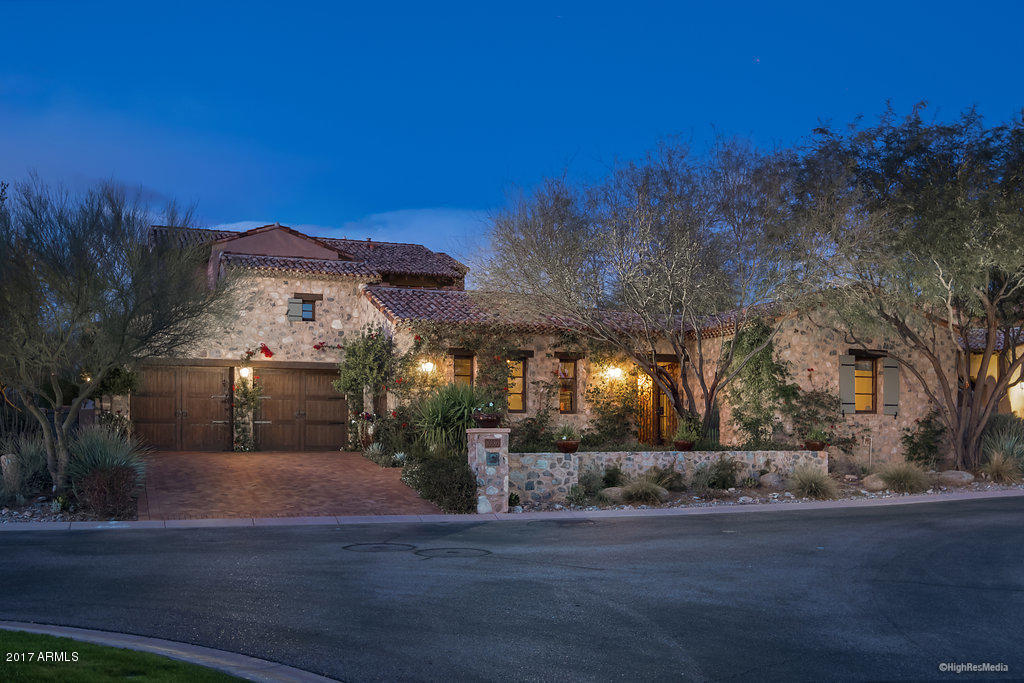 An oasis in the desert. This luxurious home is in the sought after Casita neighborhood, adjacent the Silverleaf Club and Spa. Upon arrival, the lush vegetation & rustic stone accents show this Rural Mediterranean home is unlike any other. The former model, the home comes fully appointed with spectacular finishes, including French limestone countertops, tumbled limestone floors, mahogany interior doors, antique fountains & full home automation system. Additional spaces in this open floor plan include great room with bar, family room, game room with wet bar/wine room, library/office nook & gorgeous detached guest quarters. The multiple loggias & private courtyards in the generous outdoor spaces compliment the breath-taking setting & impart the comfort & intimacy of a private retreat