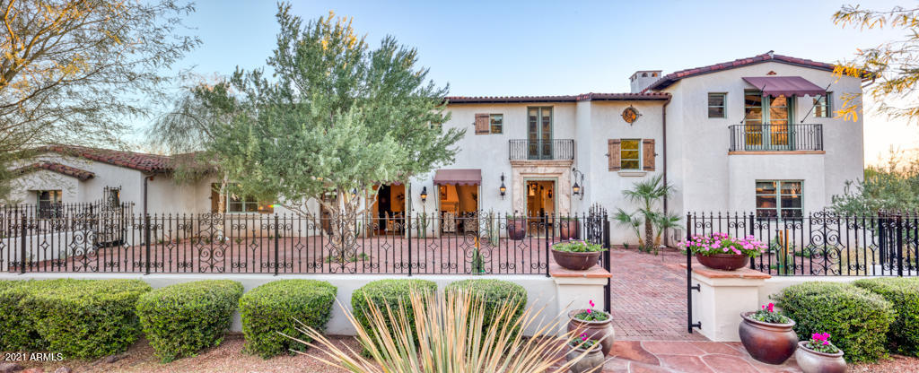 Just minutes from several PV resorts, you'll find this privately-gated, Spanish estate perfectly positioned to capture the most incredible Camelback + Mummy Mountain Views. Expertly designed by Mike Higgins + Vallone Design, this custom home is both elegant + inviting w/ stunning details thru-out such as the Italian hand-etched marble flooring, French reclaimed oak floors+limestone mantels + countless hand-painted tiles. Rectangular pool, Huge GRASS area, outdoor fireplace+many seating areas provide the perfect spaces to entertain! Great, OPEN floorplan - Gorgeous master suite, 3 lrg bedrms + 2 offices. Kitchen features island, bar seating + Copper sinks - kitchen opens to informal dining, living rm w/ Large glass retractable doors to covered patio, FULL Butler's kitchen + formal dining... ELEVATOR to private Master wing w/ 2nd office, private patio + large custom closet - the bath features Waterworks cast iron tub + Juliet balcony. Lower level features an ensuite bed, large wine cellar + family room, which could easily be converted into a game room or theater! Just off the 4-Car garage is a large laundry room with double washers/dryers, tons of storage + farmhouse sink.