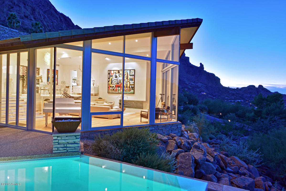 One of the Valley's most breathtaking properties- significant architecture, inspired decor and magnificent vistas all on the grounds of the world-famous Sanctuary Resort with its amazing amenities.Created by Paul Yeager as a pure Arizona contemporary, the home has been given a complete rework by Mark Candelaria that keeps all the warmth, but brings an air of sophistication and brightness.Built around the views, the great room has a penthouse-feel with towering walls of glass that create a living work of art from the panorama. Sleek and modern kitchen with the best of everything for both inside and outside dining.The master is perfection and the guest bedrooms are true 2-room suites.There is also a theatre,office and game room.Outside is spectacular-sharp pool, sundecks and unsurpassed view
