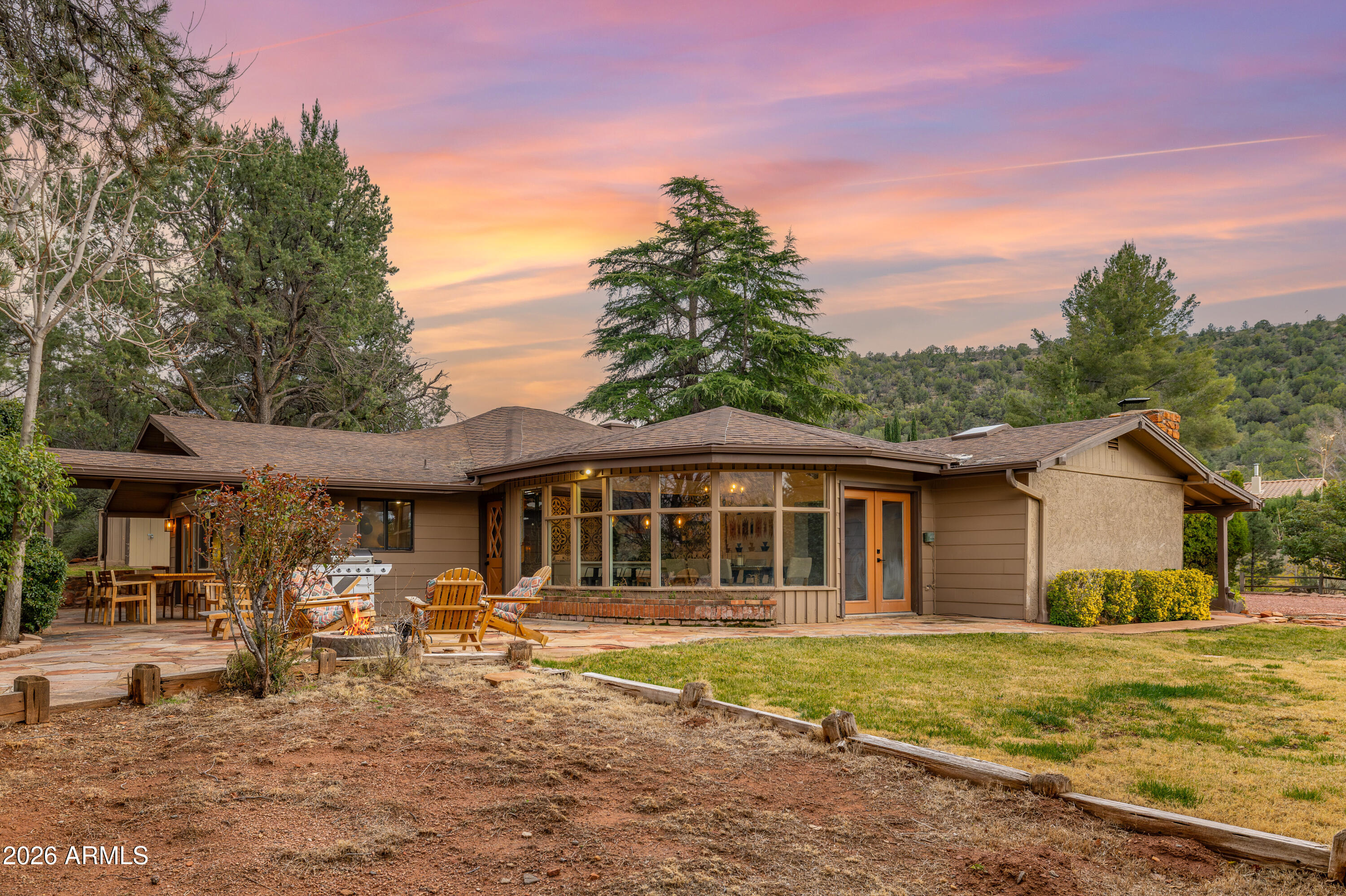 Set against Sedona's iconic landscape, this extraordinary dual-residence estate embodies the art of desert luxury. 

Experience the perfect blend of luxury, versatility, and Sedona lifestyle in these beautifully remodeled homes. A rare opportunity just minutes from Old Town Sedona. Situated on just over half an acre with no HOA, this exceptional property features two fully independent homes, making it ideal for multi-generational living, income potential, or a thriving short-term rental investment.

Currently operating as a highly successful Airbnb, both residences have been thoughtfully renovated to showcase a modern Southwest aesthetic, combining clean contemporary finishes with warm natural textures that reflect Sedona's iconic landscape.... The main home welcomes you with soaring wood-beam ceilings, expansive windows that frame the surrounding scenery, and an open, light-filled floor plan designed for gathering and relaxation. The chef's kitchen features custom cabinetry, stylish tile work, and generous counter space, perfect for entertaining or hosting guests.

The detached guest house is a true second home, complete with its own full kitchen, private living spaces, and independent functionality offering unmatched flexibility for owners and investors alike.

Outdoor living takes center stage with serene patios and inviting spaces designed to enjoy Sedona's year-round beauty and mild weather. Nestled in a quiet neighborhood yet conveniently close to restaurants, galleries, hiking trails, and all the charm of Old Town Sedona, this property captures the best of privacy and accessibility.

This is more than a home; it is a lifestyle, offering flexibility, beauty, and timeless appeal. A rare opportunity to own a refined Sedona retreat that seamlessly blends luxury living with income-producing potential.