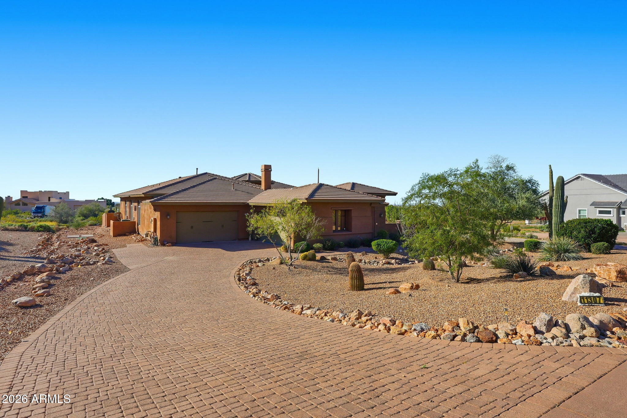Perched in Mesa with breathtaking vistas of sparkling city lights, the iconic Superstition Mountains, and the rugged beauty of the Goldfield Mountains, this exceptional home delivers desert living at its finest. Designed to impress, the gourmet kitchen is truly a chef's dream, featuring expansive counter space, gas stove, abundant cabinetry, and a butler's pantry perfect for entertaining and effortless organization. The thoughtfully designed floor plan offers four spacious bedrooms and three 1/2 baths, along with a formal living room, elegant dining room, inviting family room, private office, & separate den providing flexibility for work, relaxation, and gatherings of any size.
Take entertaining to the next level on the rooftop deck, where panoramic views create unforgettable memories!
