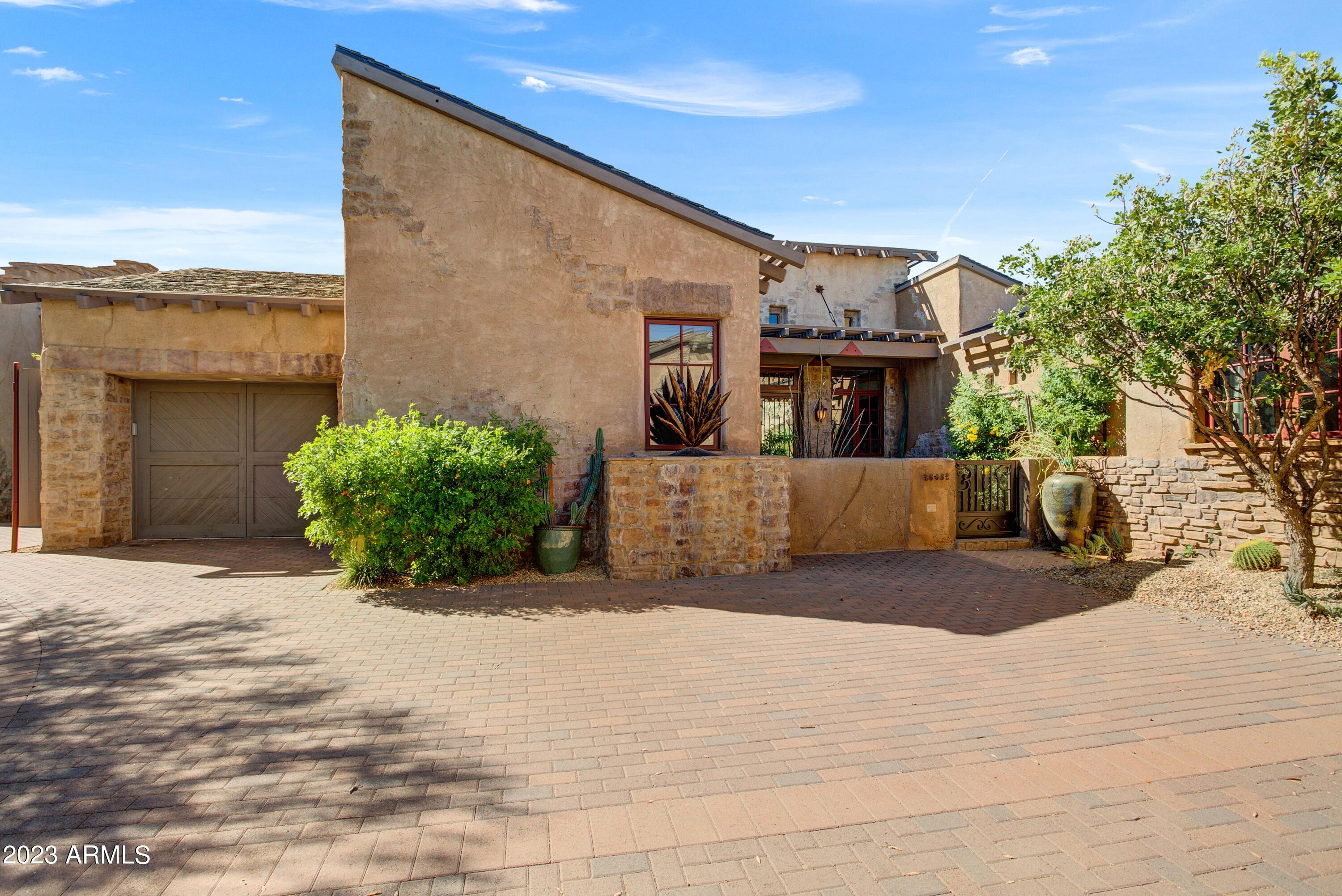 Equity Golf Membership to The Estancia Club available subject to fees and board approval * Terracina floor plan in the Enclave of LaScala * Quality architecture designed by Bob Bacon * 3 bedrooms and 3 bathrooms * Private lock and leave home offering privacy, quality, security and value - Details and features include soaring ceilings, custom cabinetry, stone flooring and recently updated * Exterior details are a blend of aggregate stucco, stone, wood and wrought iron * Outdoor living includes a sunny patio with Pinnacle Peak views, sitting area with fireplace and a built-in spa * Close proximity to walk to The Estancia Club *