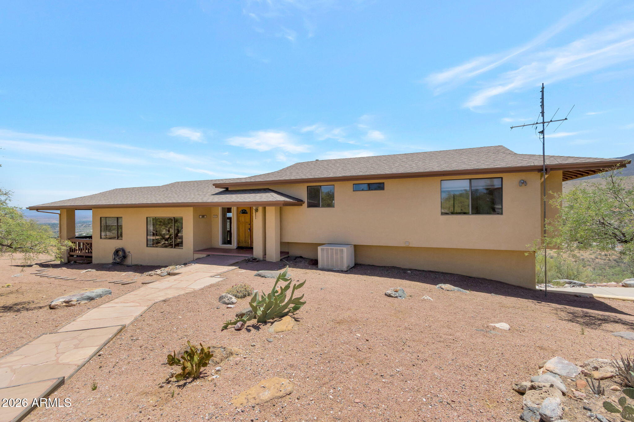 Perched high on a fully fenced 1.1-acre lot, this Clarkdale property offers breathtaking 300-degree views, including Sedona Red Rocks, Mingus Mountain, and the Verde Valley. The 3-bedroom, 2.5-bath home features a functional floor plan with all bedrooms located upstairs, along with a conveniently situated laundry room. Enjoy views from the dining room and eat-in kitchen, creating the perfect backdrop for everyday living. A separate bonus room off the garage provides flexible space for a home office, hobby room, gym, or studio, while an additional half bath adds convenience. With incredible privacy, room to roam, and endless potential, this home is ready for a new owner to add their personal touches and updates while taking advantage of its exceptional setting and views!