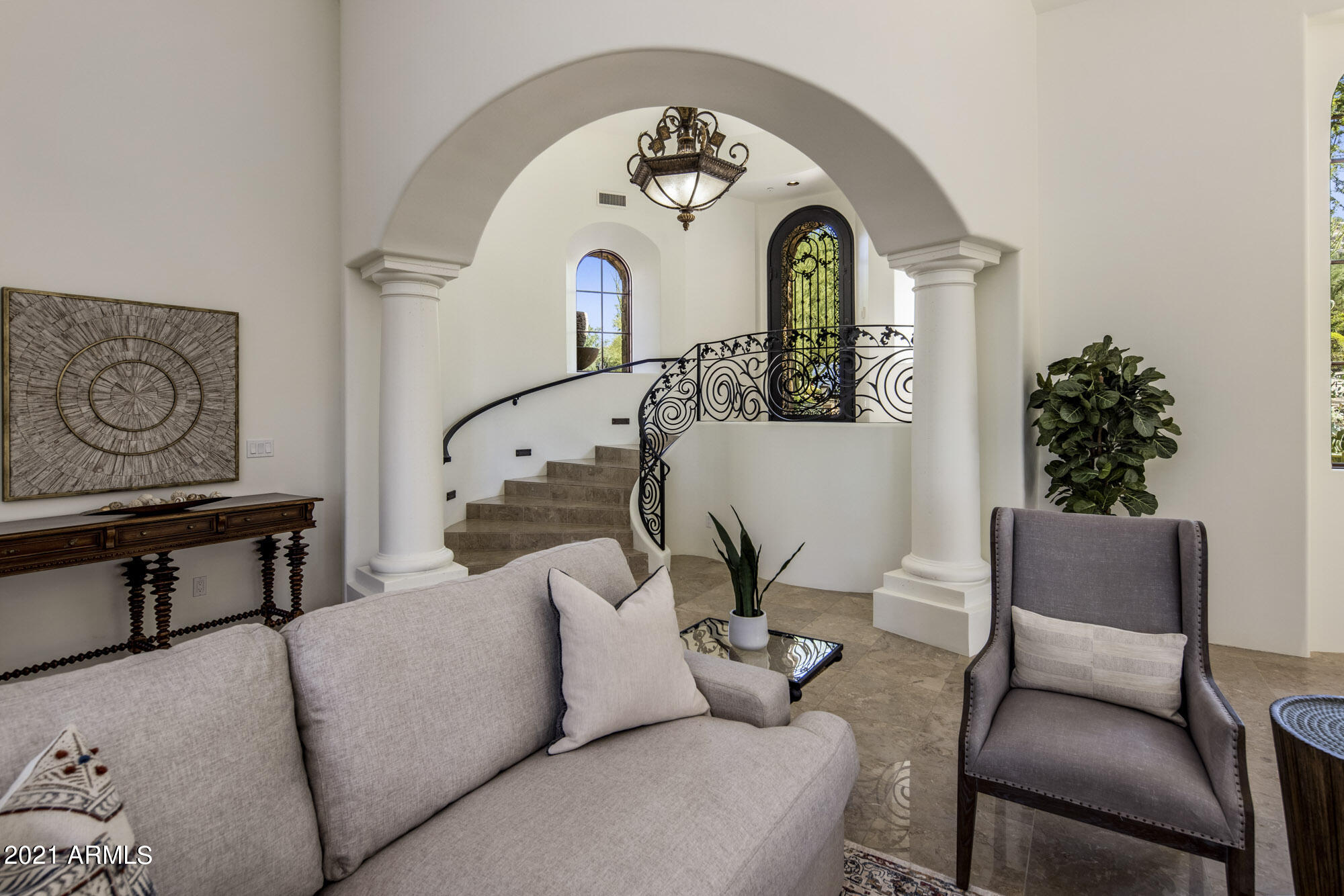 Estancia Manor invites you into your exclusive, new lifestyle. A grand entry welcomes guests to this stately home & begins to impress. French doors lead to the  quaint interior courtyard to awake w/ morning coffee or unwind w/ evening cocktails. Two full kitchens are ideal for family cooks, entertaining or professional chefs. Primary owner's suite w/walnut floors & lavishly appointed bath. Secondary owner's suite ideal for extended stays. Two additional ensuite bedrooms thoughtfully offer flexible use. Family room w/ fireplace & French doors lead to low maintenance outdoor living & pool area w/ fireplace & city light views & allows full enjoyment of what this immaculate home offers. Extended 3 car garage w/newer epoxy floors & incredible storage & built-ins. Come live Estancia Manor.