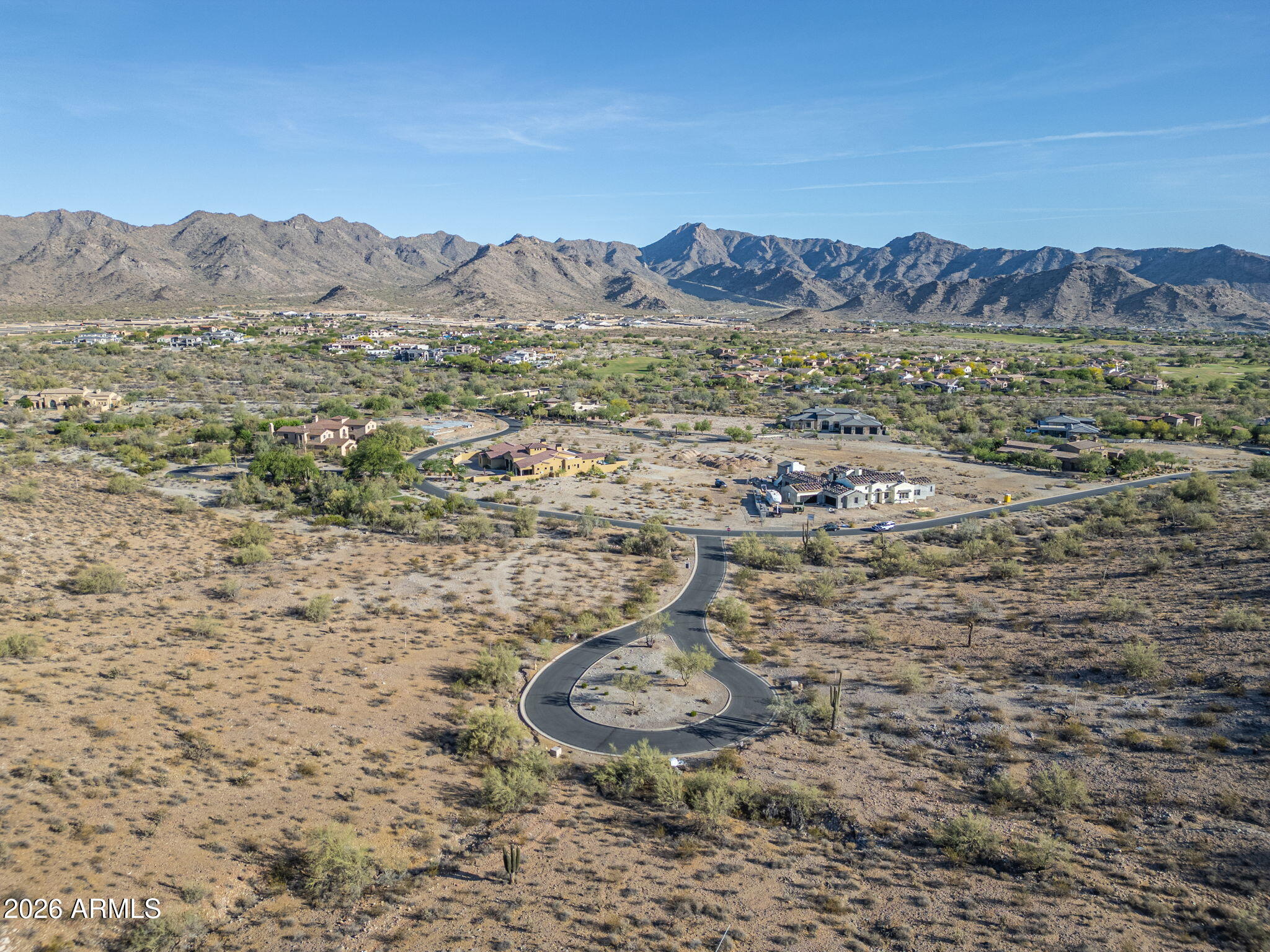Exclusive Custom Homesite in Verrado's Prestigious custom home neighborhood This premium mountainside lot is nestled in a picturesque, tree-lined neighborhood exuding timeless charm and elegance with city light views. Enjoy breathtaking mountain views & a easy-going lifestyle just 2.5 hrs drive from skiing in Flagstaff or 3 hrs from a Mexican beach. Main Street's fine dining, boutique shopping, & lively community events are a short drive away. Verrado offers resort-style pools, fitness center, championship golf, & miles of scenic trails. Parks & lush green spaces create a serene retreat, while top-rated schools & a welcoming community make this an exceptional place to make your home. Don't miss this rare opportunity to craft a luxury residence in one of Arizona's most coveted communities