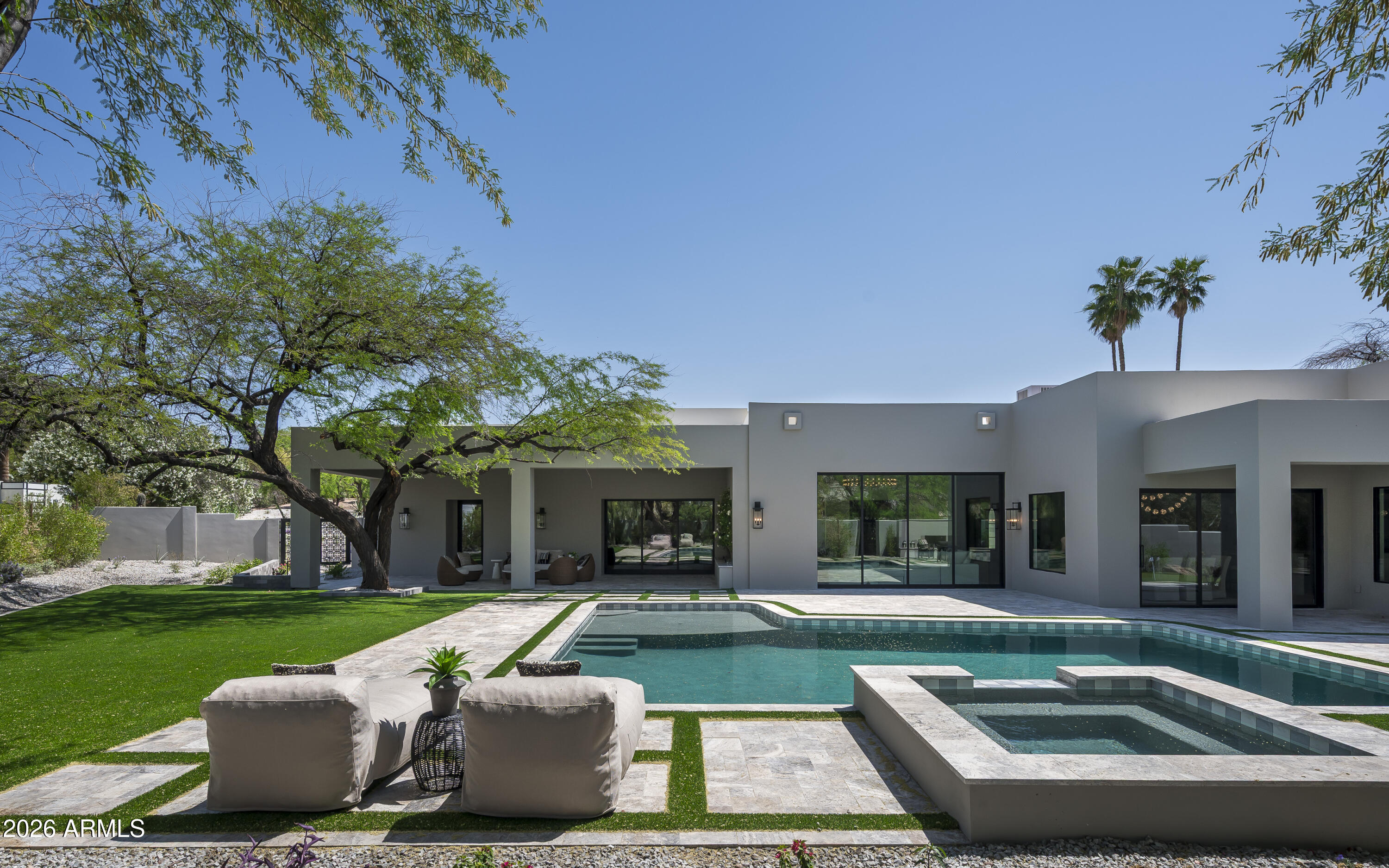Welcome to a fully reimagined Hillside Estate in an A+ Paradise Valley location surrounded by MOUNTAIN VIEWS. This Organic Desert Modern was taken down to studs and rebuilt. All new systems including underground plumbing, electrical, HVAC, roof, gas lines, drainage systems. Rare dual-primary layout with private patios, versatile office/game room/speakeasy/golf sim. Interiors showcase soaring 12 ft ceilings, architectural beam work, 
custom cabinetry, over 21 slabs of premium stone, Wolf/Sub-Zero appliances. Enjoy living on single level home w/ No HOA. 10x20 pocket slider opens to resort-style backyard with turf, putting green, heated pool, spa, new plumbing and pebble finish. Driveway w/motor court and 3-car garage. Wired for AV & Lutron Window treatments. Ask about upgrade details today!