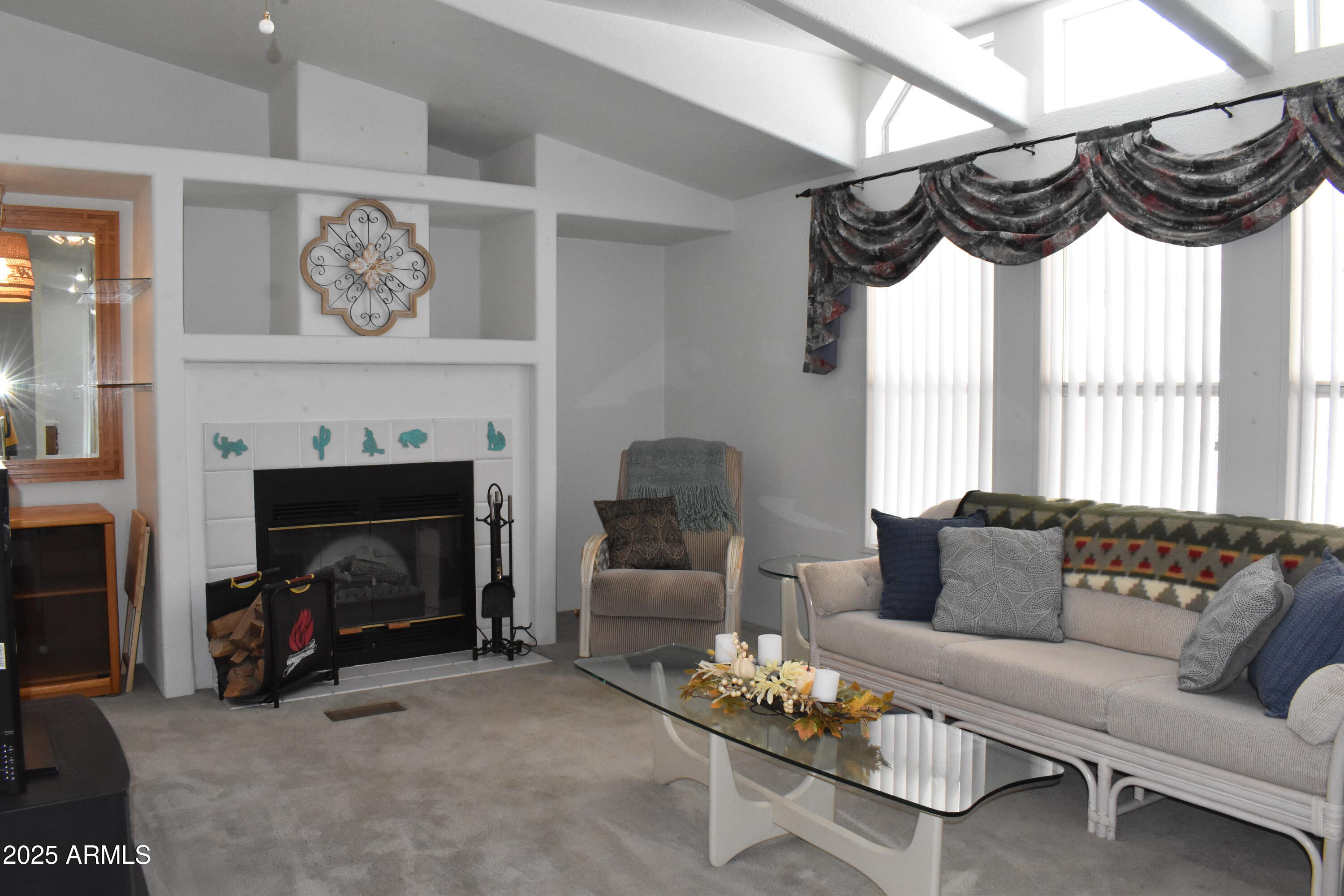 This beautiful 3-bed, 2-bath home on 1.5 lots, with views of 3 of the 9 hole golf course in Florence Gardens, a 55+ community offers, 1,904 sq. ft. with vaulted ceilings, natural light, and a cozy fireplace with built-ins. The kitchen features laminate counters and ample cabinet space, opening to the dining area and backyard. The primary suite includes dual sinks, a soaking tub, and walk-in shower, while the second bath offers a walk-in tub (2017). Low-maintenance landscaping with mature palms and a wide front porch add curb appeal. There is ample covered parking for your vehicles and a spacious 2 room shed/office. HOA amenities include multiple pools and hot tubs, pickleball, as well as a variety of indoor activities, and weekly events. Located along Hwy 79 between Phoenix and Tucson.