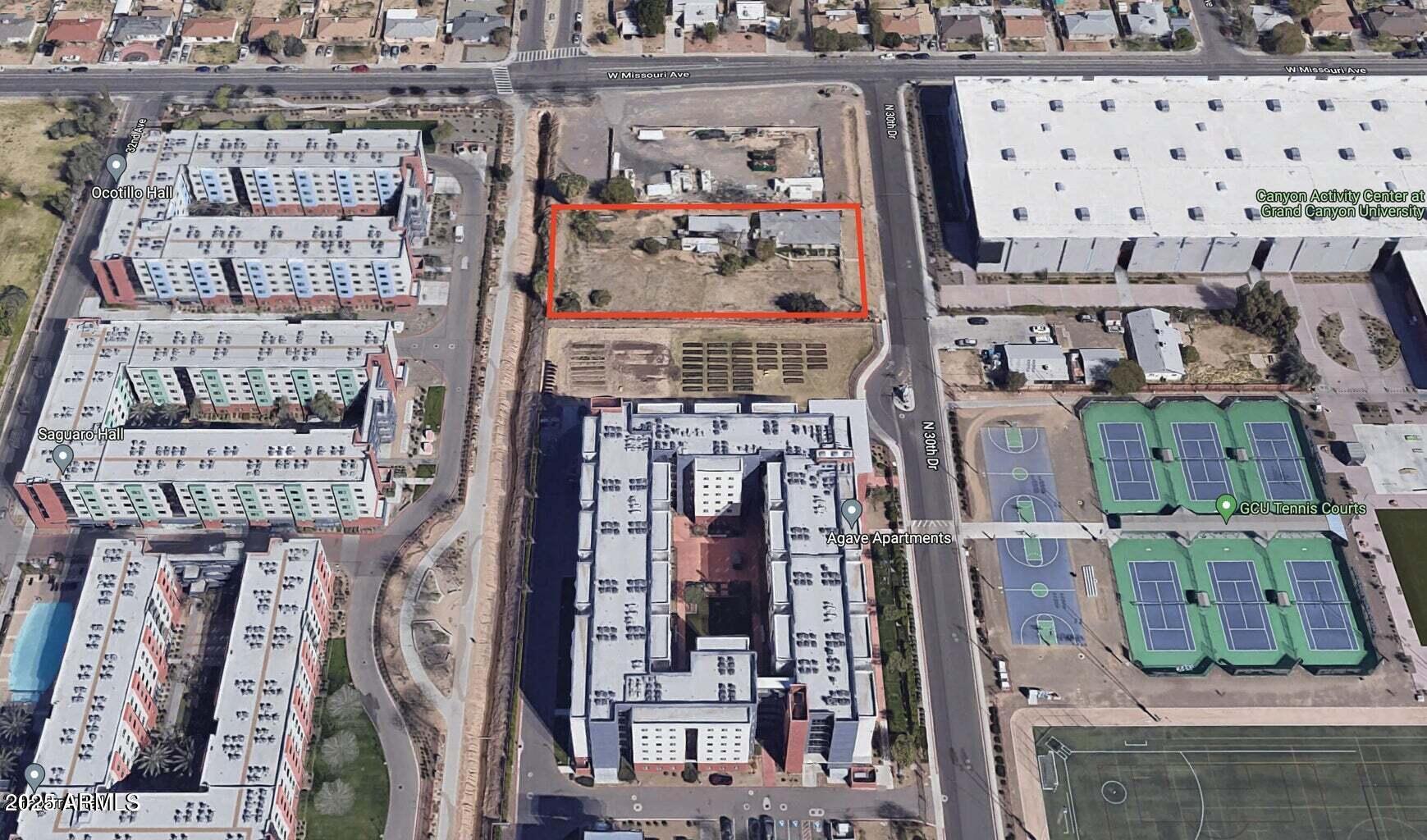 This property is a rare adjoining property to Grand Canyon University located in a tax advantaged Opportunity Zone. It is zoned Multi-Family and is in the middle of GCU's expansion plan. Let your imagination create the endless opportunities for this unique parcel of land.