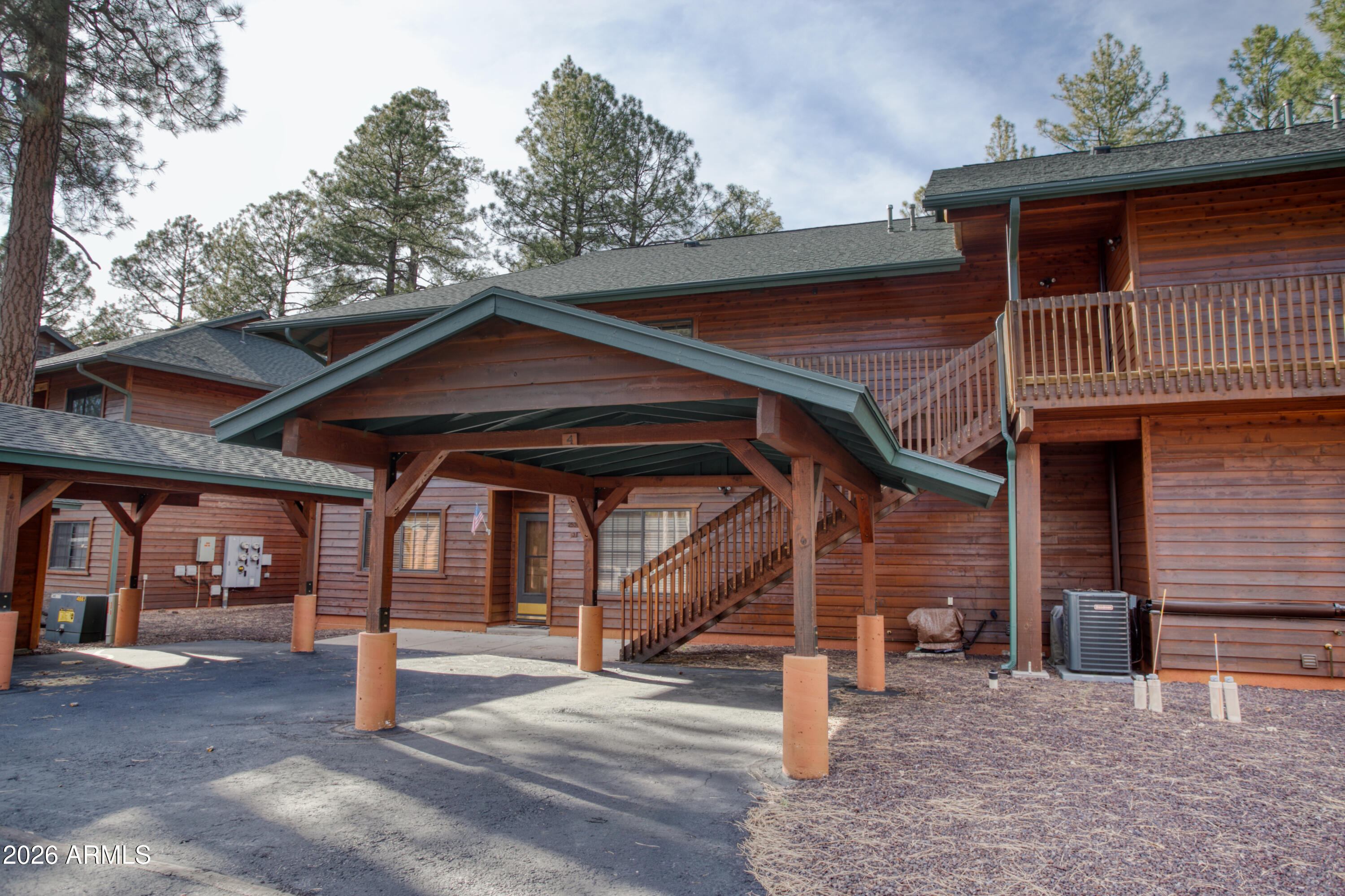 Escape to the cool, serene beauty of Arizona's White Mountains and experience easy mountain living in the gated Village at Pinetop Country Club. This upper-level, fully furnished condo is truly turnkey, offering a perfect getaway or full-time retreat surrounded by tall pines and fresh alpine air.

Enter through a welcoming foyer into a striking great room where vaulted ceilings with custom log beams immediately draw your eye, adding warmth and rustic elegance. The open-concept living space centers around a dramatic floor-to-ceiling stone gas fireplace, ideal for cozy nights in after a day outdoors. Expansive windows fill the space with natural light and frame the tranquil forest views, bringing the outdoors in. The thoughtfully designed split floor plan provides both privacy and functionality. The oversized primary suite serves as a relaxing retreat, featuring a spacious layout, dual sinks, a jacuzzi tub to relax in, and an expansive walk-in closet. The secondary bathroom offers a tub/shower surround, making the home comfortable and practical for guests and everyday living.

At the heart of the home, the spacious kitchen is designed for gathering and entertaining, complete with granite tile countertops, abundant cabinetry, and a dedicated dining area. It flows seamlessly into the living space and out to the oversized covered back deck, your private escape to enjoy cool mountain temperatures, morning coffee, or evenings under the pines.

Additional features include a natural gas BBQ hookup, no more hauling propane tanks, and a new roof installed in 2023 for added peace of mind. Meticulously maintained and offered fully furnished, this home is truly move-in ready. NEW carpet on the back deck!

Ideally located near the front of the community and directly across from Sky Hi Road, you'll enjoy quick access to miles of National Forest trails for hiking, biking, and year-round recreation. Just minutes away, Pinetop Lakes Golf Club is open to the public and offers golf, tennis, pickleball, dining, and a pro shop, with two additional private clubs available to join.

Whether you're seeking a seasonal getaway or a full-time mountain retreat, this home embodies the best of White Mountains living, cooler weather, crisp pine-scented air, cozy fireside evenings, and endless outdoor adventure, all wrapped in comfort, style, and convenience.

** New Carpet on the Porch in 2024 **

***

Discover the White Mountains of Arizona, where adventure, beauty, and fresh mountain air come together. Enjoy four stunning seasons, 40 lakes, and 600+ miles of rivers and streams, perfect for fishing, kayaking, and exploring.

Hit the trails on one of the largest trail systems in the Southwest, or spend winter days at Sunrise Ski Resort, just 40 minutes away with three mountains of skiing, snowboarding, and sledding.

Love shopping or culture; wander through antique shops, summer arts & craft fairs, and lively music festivals. Golfers can tee off at seven scenic courses, including three public gems.

It's no wonder Pinetop-Lakeside was voted the "Best Cabin Region in the U.S."

The White Mountains, Arizona's best-kept secret. Come explore and embrace the MAGIC!