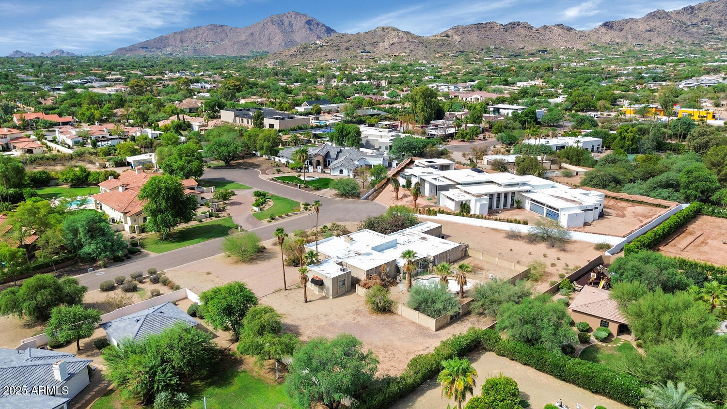 This is an exceptional, yet rare opportunity in the heart or Paradise Valley. The value is all in the lot which is a flat one-acre parcel with mountain views and endless potential. Surrounded by multimillion dollar estates, the building options are boundless and the upside is limitless!
