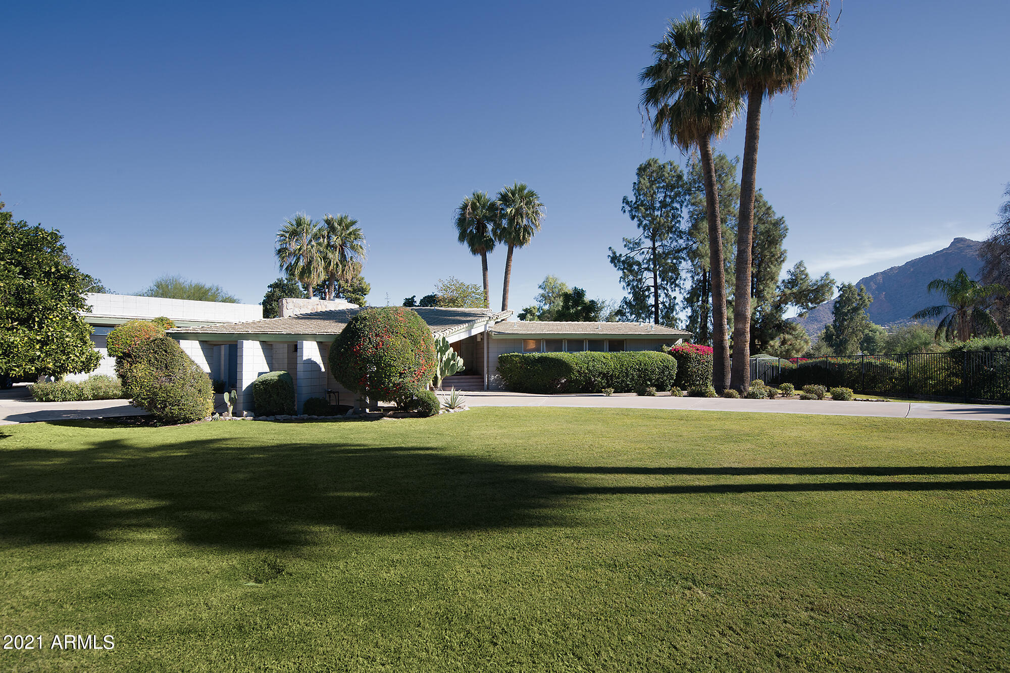 New to Market: An architecturally significant property, on over an acre, located on 17th hole of the Paradise Valley Country Club Golf course. Priced at $3,100,000. There are extraordinary views of the golf course and Camelback Mountain from the master bedroom, living and dining rooms as well as the patio and pool area. 
A circle Drive leads to a Porte-cochère entry to the home. It is believed this home was designed by Charles Montooth, a fellow at the Frank Wright School of design, this would have to be confirmed by the Buyer.