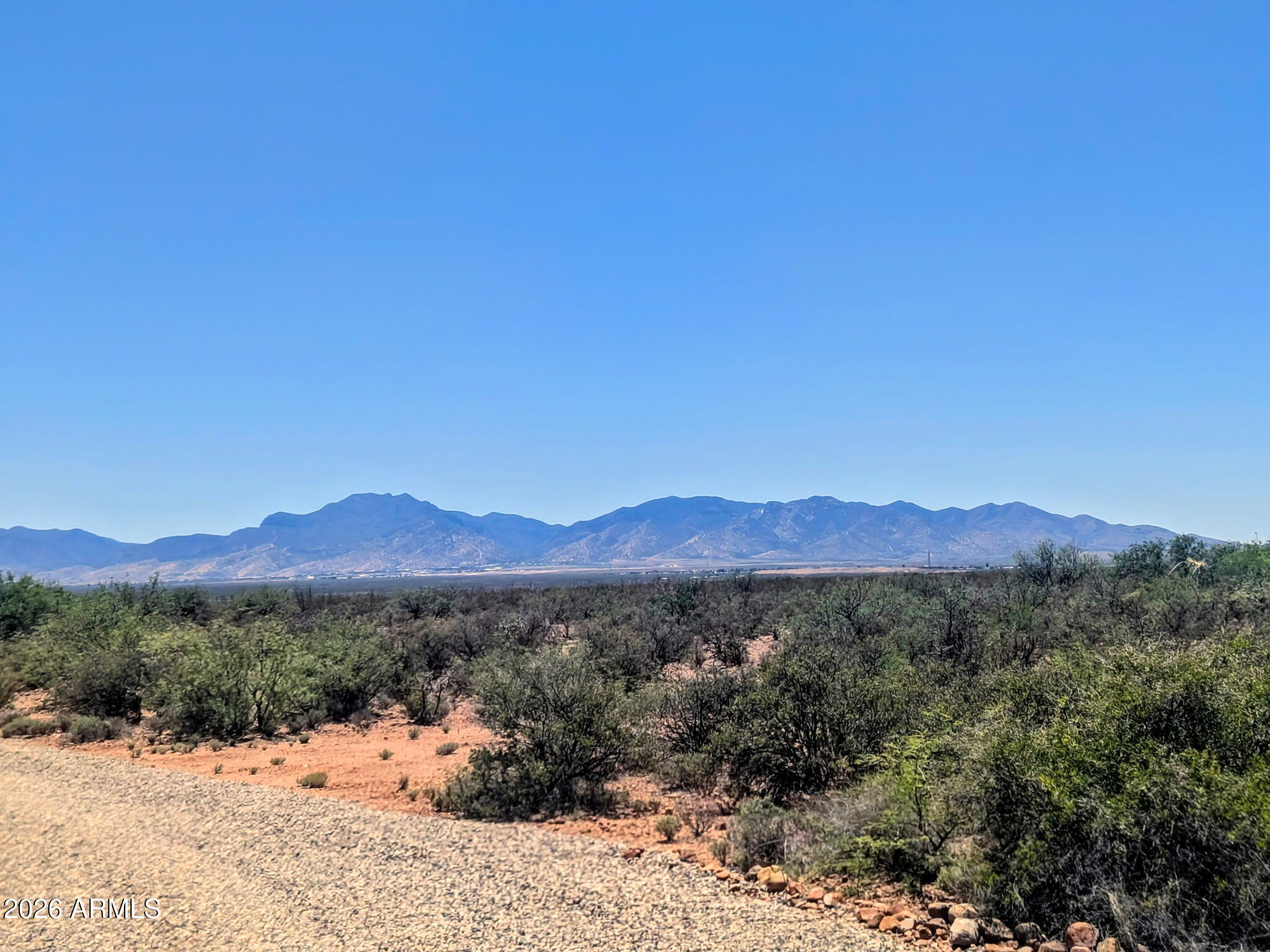 Escape to wide-open spaces with this nearly 4-acre parcel offering stunning mountain views and endless possibilities. Whether you're ready to build your dream home, create a horse property, or establish a peaceful rural retreat, this land provides the space and freedom to bring your vision to life. A shared well is available, and the expansive acreage is well-suited for horses, livestock, gardens, workshops, or simply enjoying the beauty and privacy of country living. Experience breathtaking sunsets, star-filled skies, and the tranquility of rural Arizona, all while still being within reach of local amenities!