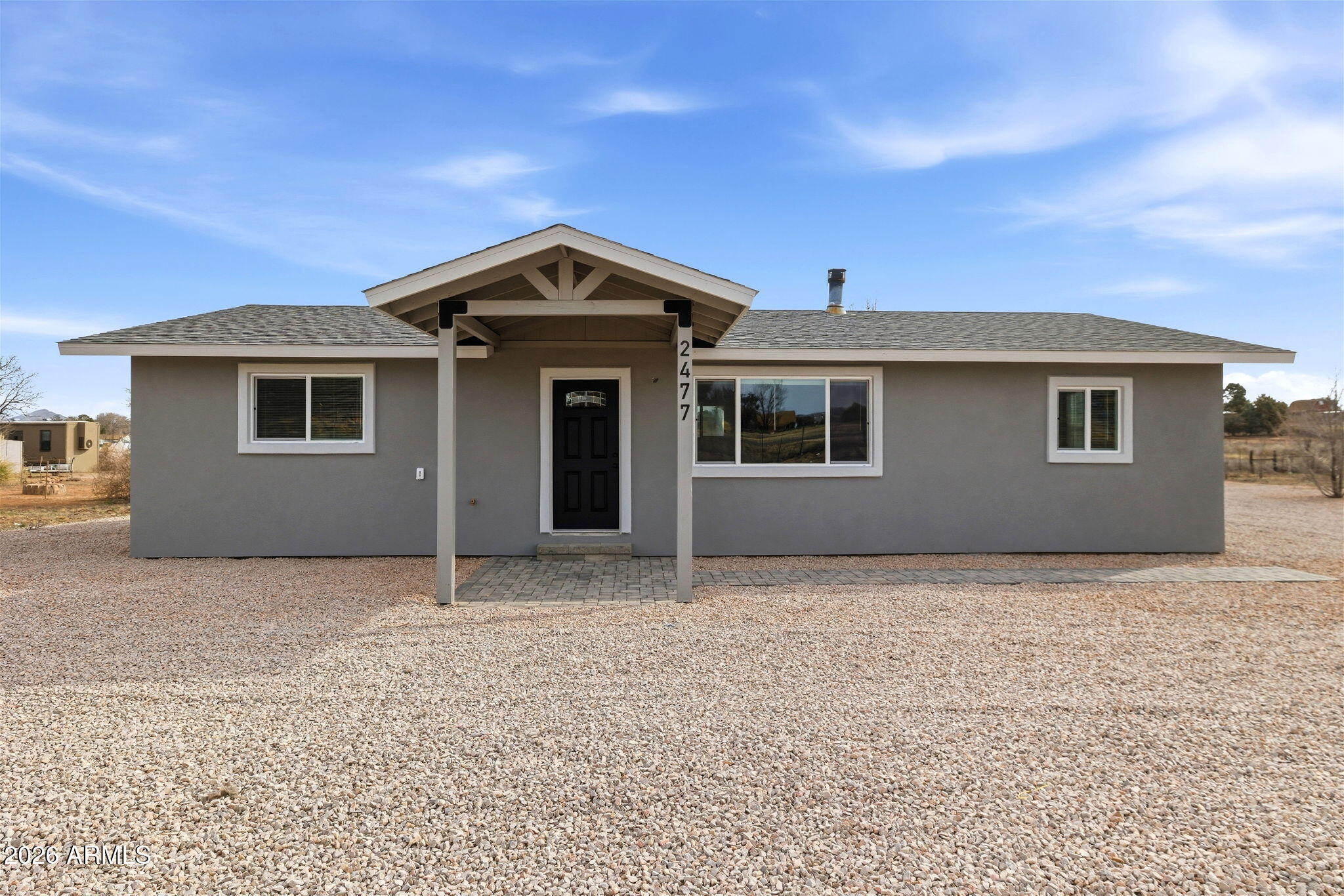Welcome to your dream property in beautiful Chino Valley, AZ! This fully updated (including new drilled well) 3-bedroom, 2-bath home boasts a thoughtful split floor plan that maximizes comfort and privacy, perfect for families or anyone seeking functional, modern living. Situated on approximately 2.5 acres of fully fenced land, you'll enjoy the freedom and space of country living with plenty of room for animals, hobbies, or future expansions. Step inside to discover a completely remodeled interior with all new finishes throughout -- fresh paint, updated flooring, stylish lighting, and modern fixtures create a welcoming atmosphere from the moment you arrive. The open living area flows seamlessly into an updated kitchen -- perfect for everyday living and entertaining alike. Outside, the expansive property features wide-open views, plenty of privacy, and a giant outbuilding that's ready for your imagination. Use it as a workshop, oversized garage, tack room, or creative studio -- the possibilities are endless! The fully fenced perimeter gives peace of mind for pets, livestock, or play, and the gently rolling terrain adds character to this rare offering. Key Highlights: Spacious 3 bedrooms + 2 full bathrooms with a smart split layout Fully renovated and updated -- modern comfort with country style Approximately 2.5 acres, fully fenced for privacy and security Massive versatile outbuilding -- perfect for vehicles, projects, storage, animals, and more Great location close to local amenities while still offering peaceful rural living Beautiful outdoor space with room to roam and grow This is a rare opportunity to own a completely updated home with acreage and a high-value outbuilding in a sought-after Chino Valley location. Don't miss out -- come see what country living at its best really feels like!