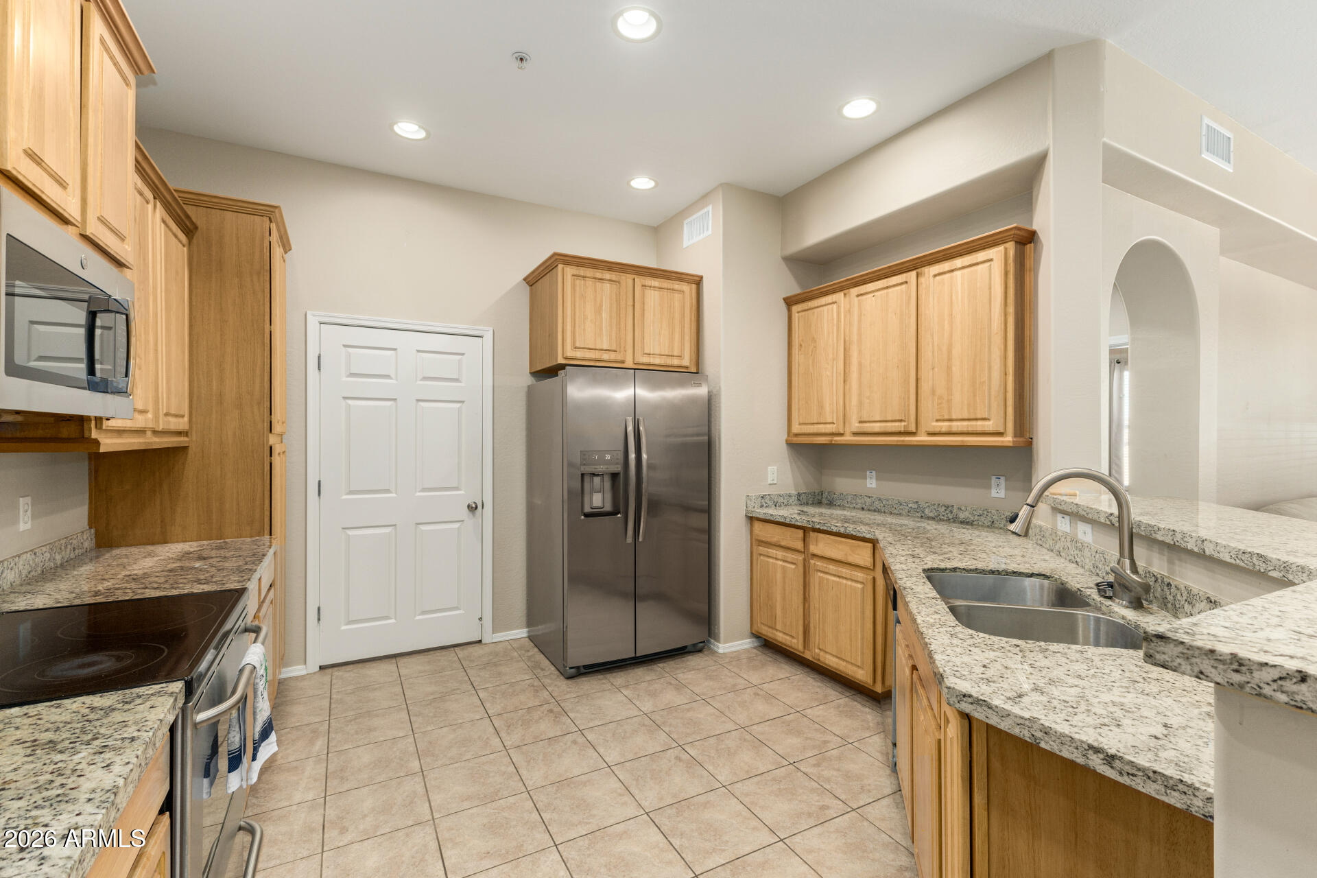 Gated community • 3rd-floor condo with elevator • Balcony • Near Banner Del Webb Medical Center

2BR/2BA condo with 1,289 sq ft located on the 3rd floor with elevator access and covered parking. Open layout with granite countertops and updated tile flooring (2025). Private balcony adds outdoor space. Gated community with pool, spa, clubhouse, and fitness center. Designed for low-maintenance living with HOA-maintained grounds. Approx. 0.4 mi to Banner Del Webb Medical Center and under 1 mi to grocery, coffee, and dining. Convenient access to Grand Ave (US-60) for commuting and services.