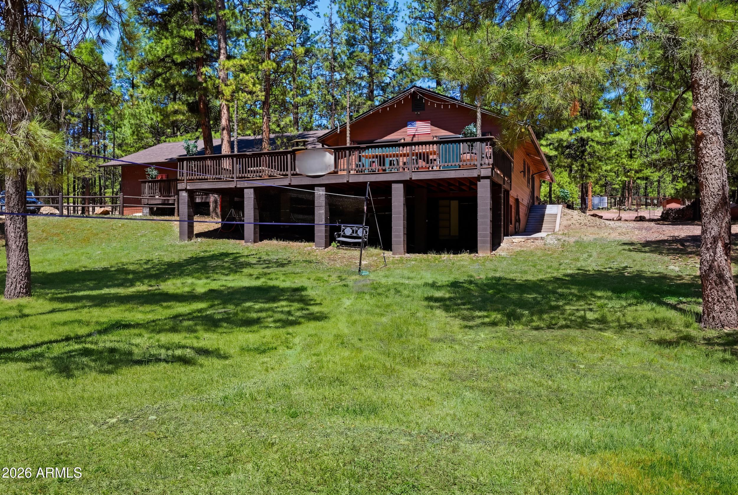 You don't want to miss this completly renovated home.  This is an amazing full time home as well as an option for a successful VRBO (currently used p/t as a VRBO) Seller has spared no expense to make this home beautiful. 4 bedroom/3 bath home with open floor plan, great outdoor entertaining area and a finished basement area that would make a great office or craft room. Sit on your deck and watch the wildlife or have a refreshment as your unwind in the hot tub. Plenty of room for RVs, horses or more. Beautifully furnished (with the exception of a few items) this home is ready to move in. Room for a larger family or guests. T&G ceilings give the warmth of a cabin feel but the modern interior brings complete sophistication to the home. Great grass area good for sports, volleyball, kicking the ball around, horseshoes, Homes has 2 newer AC units. DON'T MISS YOUR CHANCE for a beautiful home and potential of extra income.