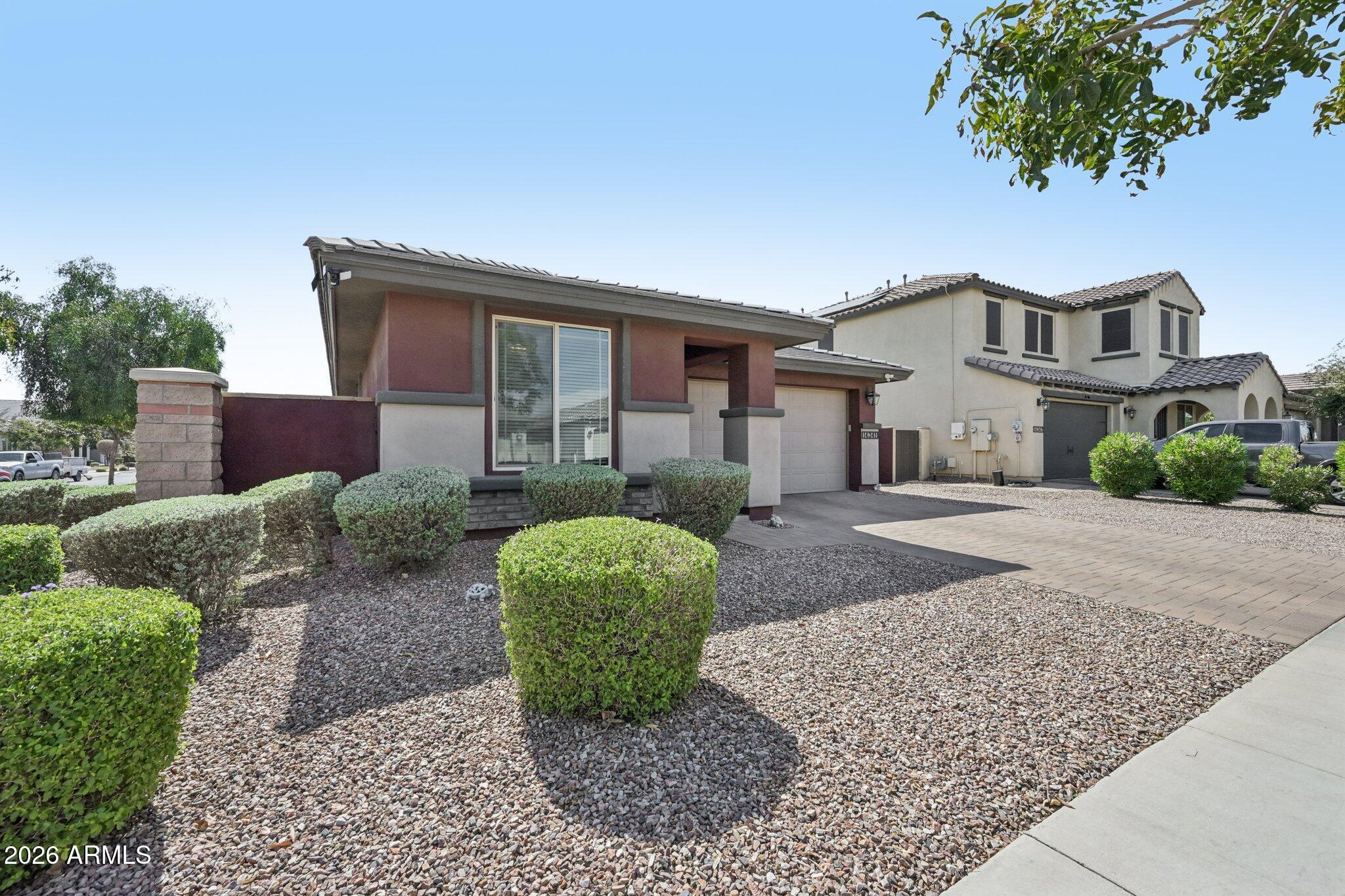 Welcome home to the highly sought-after Marley Park community in Surprise! This beautifully maintained 3-bedroom, 2-bath residence offers the perfect combination of comfort, style, and functionality. From the moment you step inside, you'll appreciate the spacious open-concept floor plan designed for both everyday living and entertaining.
The heart of the home features a stunning kitchen with granite countertops, a large center island, gas range, ample cabinetry, and plenty of workspace for family gatherings and special occasions. Tile flooring throughout the entire home provides both elegance and easy maintenance.
The spacious primary suite serves as a private retreat with dual sinks, a relaxing garden tub, separate walk-in shower, and generous closet space. Two additional bedrooms Two additional bedrooms offer flexibility for family, guests, or a home office. All bathrooms have comfort height toilets and secondary bath offers a walk-in shower 



Step outside to your low-maintenance backyard oasis featuring artificial turf, an extended covered patio perfect for outdoor dining and entertaining, and an additional storage shed for all your tools and hobbies. There is an 8' RV gate on the side of the home. The epoxy-coated garage floor adds a clean, finished look while providing durability for years to come. The garage door is 8' tall for those extra large vehicles. Additional upgrades include a whole-home soft water system and the peace of mind that comes with a backup generator.



Living in Marley Park means enjoying one of Surprise's most desirable master-planned communities, complete with resort-style pools, a clubhouse, playgrounds, lush green parks, walking trails, and year-round community events that create a true neighborhood atmosphere.



Whether you're looking for the perfect place to raise a family, entertain friends, or simply enjoy the Arizona lifestyle, this exceptional home checks all the boxes. Don't miss your opportunity to own a beautiful home in one of the West Valley's most sought-after communities!