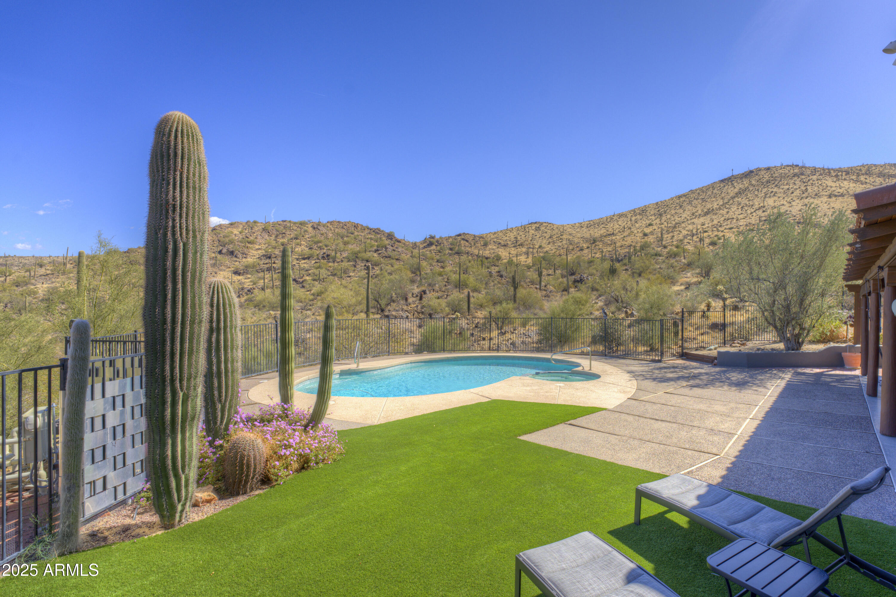 LUCKY 7.77 ACRES -PRIVATE VALLEY HORSE PROPERTY BACKING TO OPEN DESERT. 
Recently upgraded, tucked into a quiet valley setting, this rare Cave Creek property offers privacy, views, and access to nature that buyers are searching for -- with Cave Creek Regional Park and Tonto National Forest right at your back yard. Set on approximately 7.77 acres (two parcels), this inviting 3-bedroom, 3-bath home offers a warm, welcoming feel with thoughtful spaces for both everyday living and entertaining. 
A cozy library with custom rock fireplace and built-in shelving creates the perfect
retreat, while a built-in bar adds a touch of fun for hosting friends and family. 
This was designed with horse owner in mind but barn can easily be converted to a shop or car collectors garage. OWNER MAY CARRY. Owner designed with horse owners in mind but could have many other uses.
For equestrians, the property features a mare motel with turnouts and ample room to expand into a
larger equestrian setup.  Whether you're a casual rider or looking to build out a more extensive facility,
the land, layout, and location offer exceptional flexibility. Owned solar adds efficiency and value, while
the natural desert surroundings provide breathtaking views, abundant wildlife, and a true Arizona
lifestyle experience. This is more than a home -- it's a private desert retreat with room to grow, ride,
and enjoy the best of Cave Creek living.