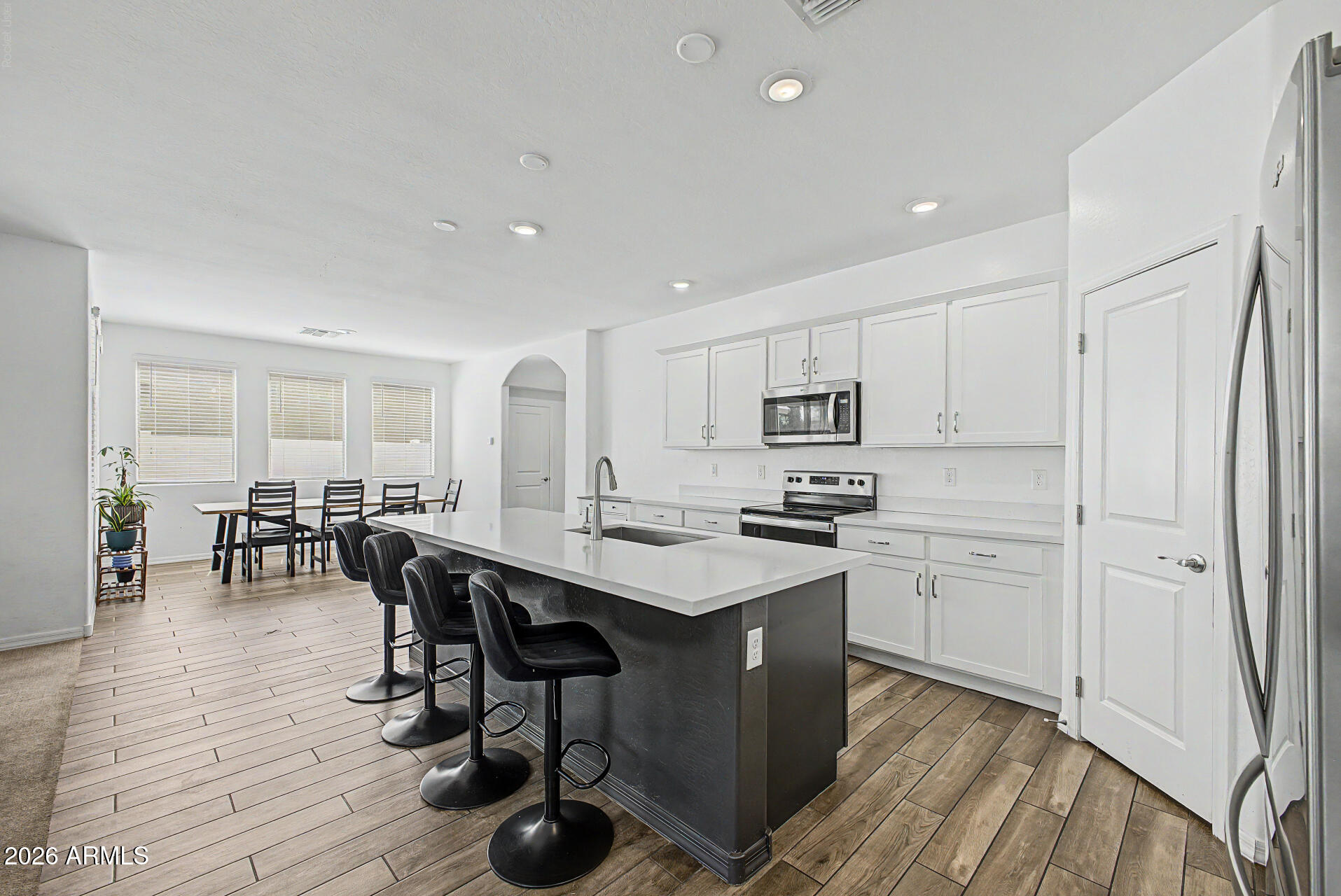 Beautifully maintained 2020-built home located in the gated Encanta community. Offering 4 bedrooms, 2.5 bathrooms, this spacious residence features an open-concept floor plan with soaring ceilings, abundant natural light, and versatile living spaces. The kitchen is complete with a large center island, breakfast bar, ample cabinetry, and generous counter space. Upstairs, you'll find spacious bedrooms and a well-appointed primary suite with room to relax and unwind. The low-maintenance backyard offers endless possibilities for customization and outdoor enjoyment. Conveniently located near parks, schools, shopping, dining, and freeway access, this home combines modern comfort with everyday convenience.