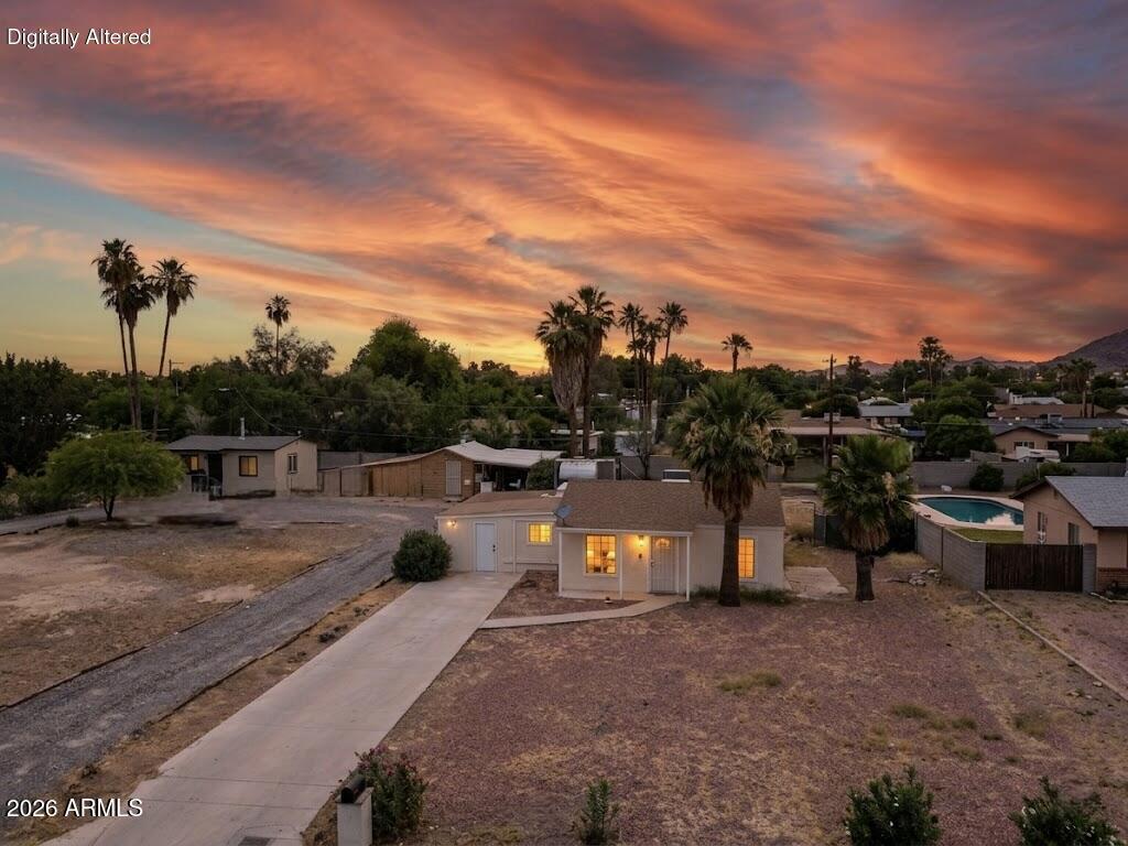 SINGLE-LEVEL 4 bed, 2 bath Phoenix ranch sitting on a MASSIVE irrigation lot with unbeatable city access -- hop on I-17 in minutes! Per city, you can keep a HORSE or small animals and irrigate 18x a year -- rare for an in-city lot this size. Inside features tile throughout, GRANITE countertops, breakfast bar, stainless steel appliances, and LUXURY light fixtures. PRIMARY SUITE with full bath. Backyard offers a PAVED PATIO, storage shed, and WHOLE-HOME WATER SOFTENER. Freshly painted! Close to dining, schools, and major freeways. Big lot, great location, single-level living -- this one won't last!