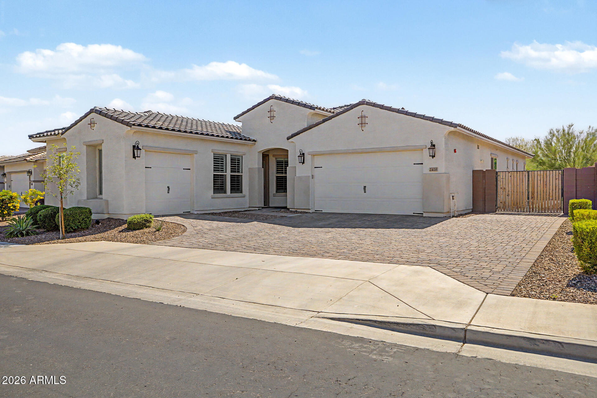 Voted ''Best Home on Tour''! This stunning 2023 Taylor Morrison ''Adelaide'' home (2,699 sf) sits on a premium 9,386 sf cul-de-sac lot in Buckeye. Enjoy ultimate privacy with no front/rear neighbors, backing a desert wash with mountain views.

Over $225K in upgrades! Features a private attached casita with dual access, living area, bed & full bath. The main home boasts wood-look tile, plantation shutters, & a chef's kitchen with GE Café gas appliances & a huge quartz island. A massive multi-slider opens to a travertine backyard oasis with turf, a pergola, & water feature. Includes a 3-car epoxy garage, owned water softener & tankless water heater. Prime location off Verrado Way near Costco & the new Verrado Marketplace! Access to community pool.