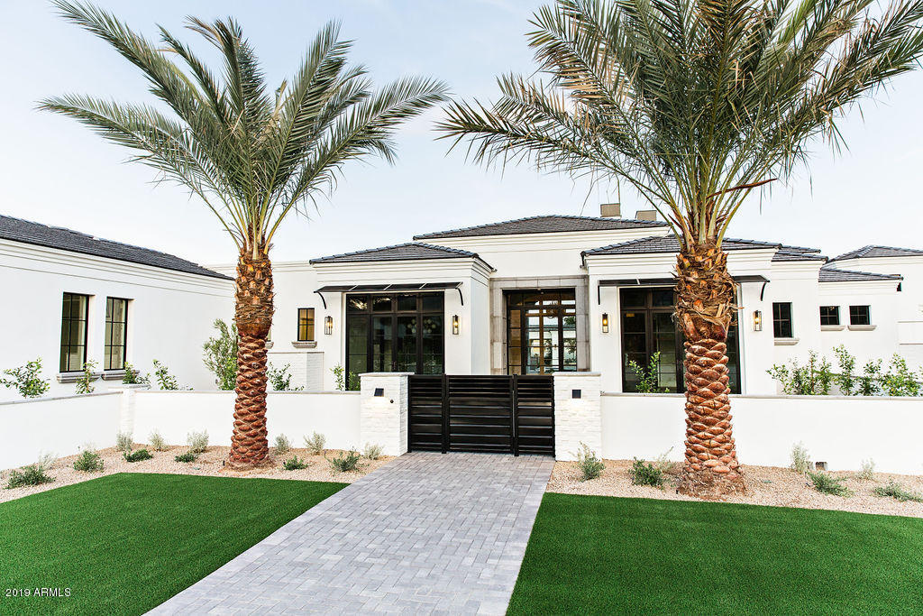 Nothing of its kind seen on the market, a brand new build, open and inviting layout with spacious rooms, a detached guest house that opens to the most amazing pool with a linear outdoor fireplace and built in bbq/bar at the pool lounge area, retractable doors, 5 car garage, private master retreat that will blow you away with its own private courtyard and outdoor shower, huge master closets with w&d hookup and a exercise room, a huge impressive wet bar and details/finishes not seen in this price range, all wood floors throughout, artificial turf, 570 bottle wine room, lush landscaping, gated auto court and courtyard, foam insulation, fabulous mountain views seen throughout the home, come see what 20 years of striving for perfection has created by J.M. Wall Development
