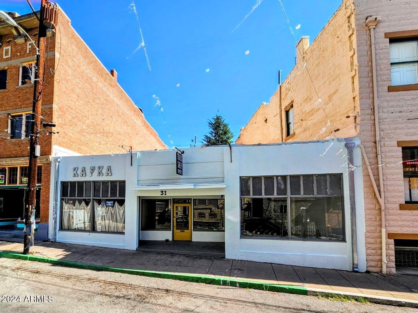 DOWNTOWN OLD BISBEE - 2,603 sq ft., Three Separate Retail Spaces/Storefronts - Each unit is approximately 820 sq ft., with separate entrances, large display windows, 15' ceilings, separate electrical meters. Recent improvements include new HVAC system, new roof, upgraded electrical and plumbing, new interior and exterior paint, and two additional bathrooms- so that each unit has their own.